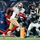 Jauan Jennings #15 of the San Francisco 49ers scores a touchdown as we look at the best Chiefs vs. 49ers NFL player props