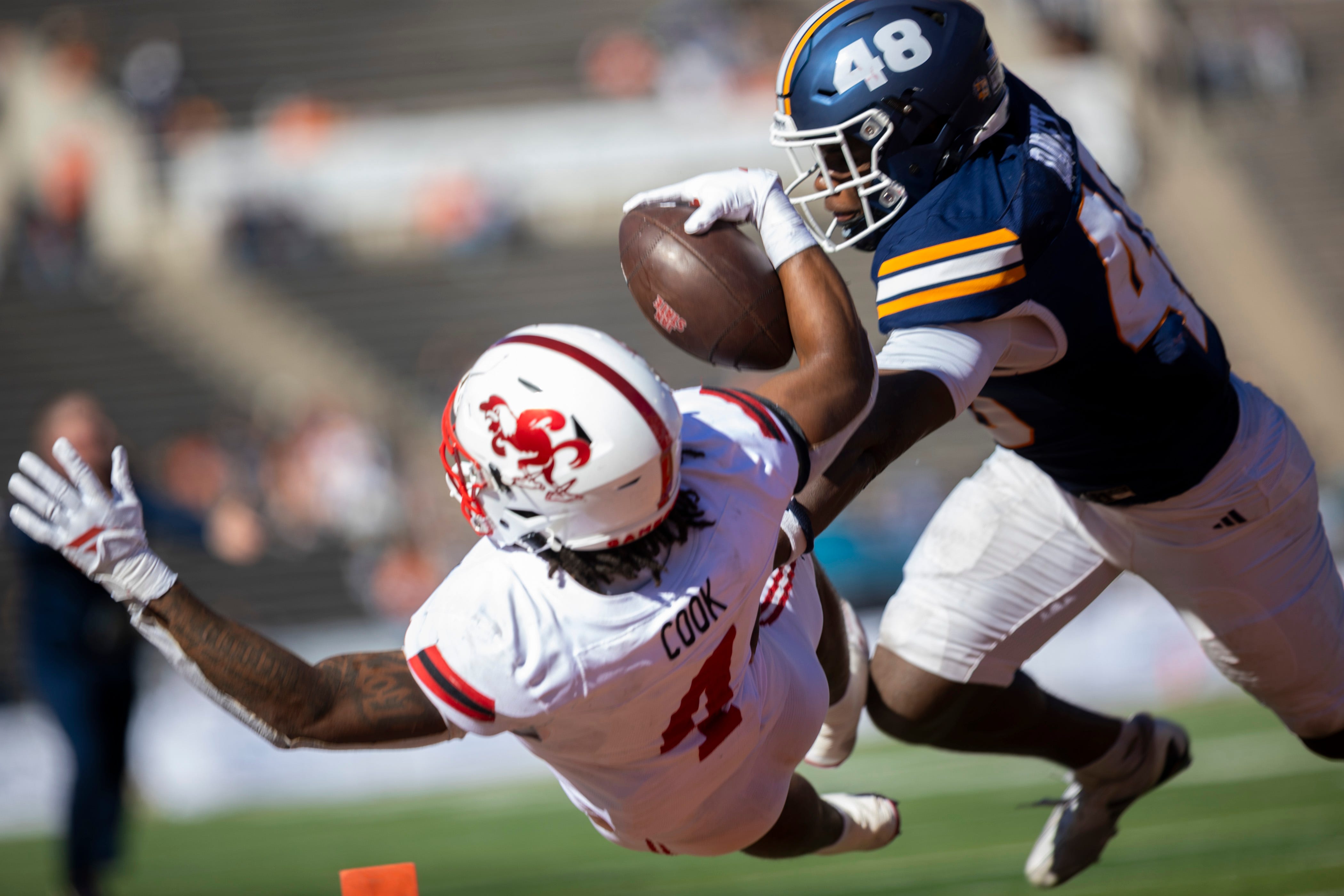 Jacksonville State Gamecocks running back Cam Cook dives in for a touchdown as we make our best Troy vs. Jacksonville State prediction.