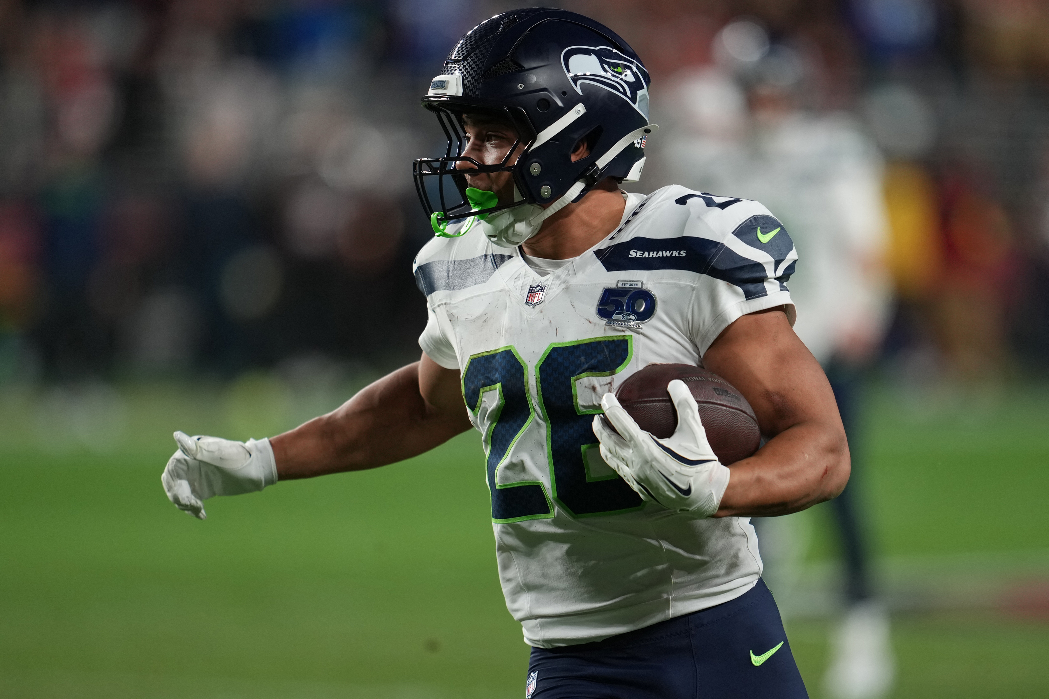 Seattle Seahawks running back Zach Charbonnet (26) rushes the ball as he is featured in our Super Bowl odds.