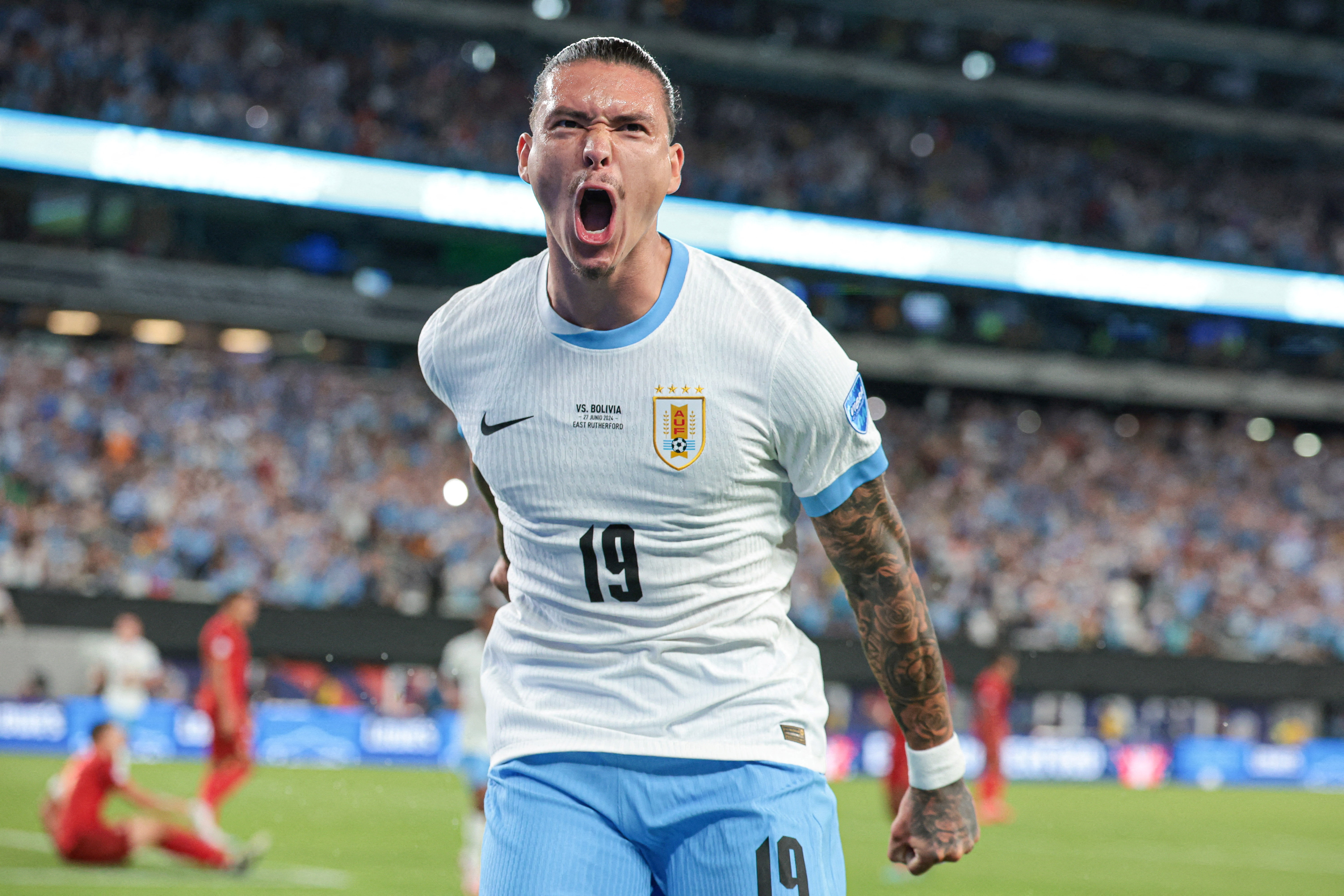 Uruguay forward Darwin Nunez celebrates a goal as we make our best Saudi Arabia vs. Uruguay prediction.