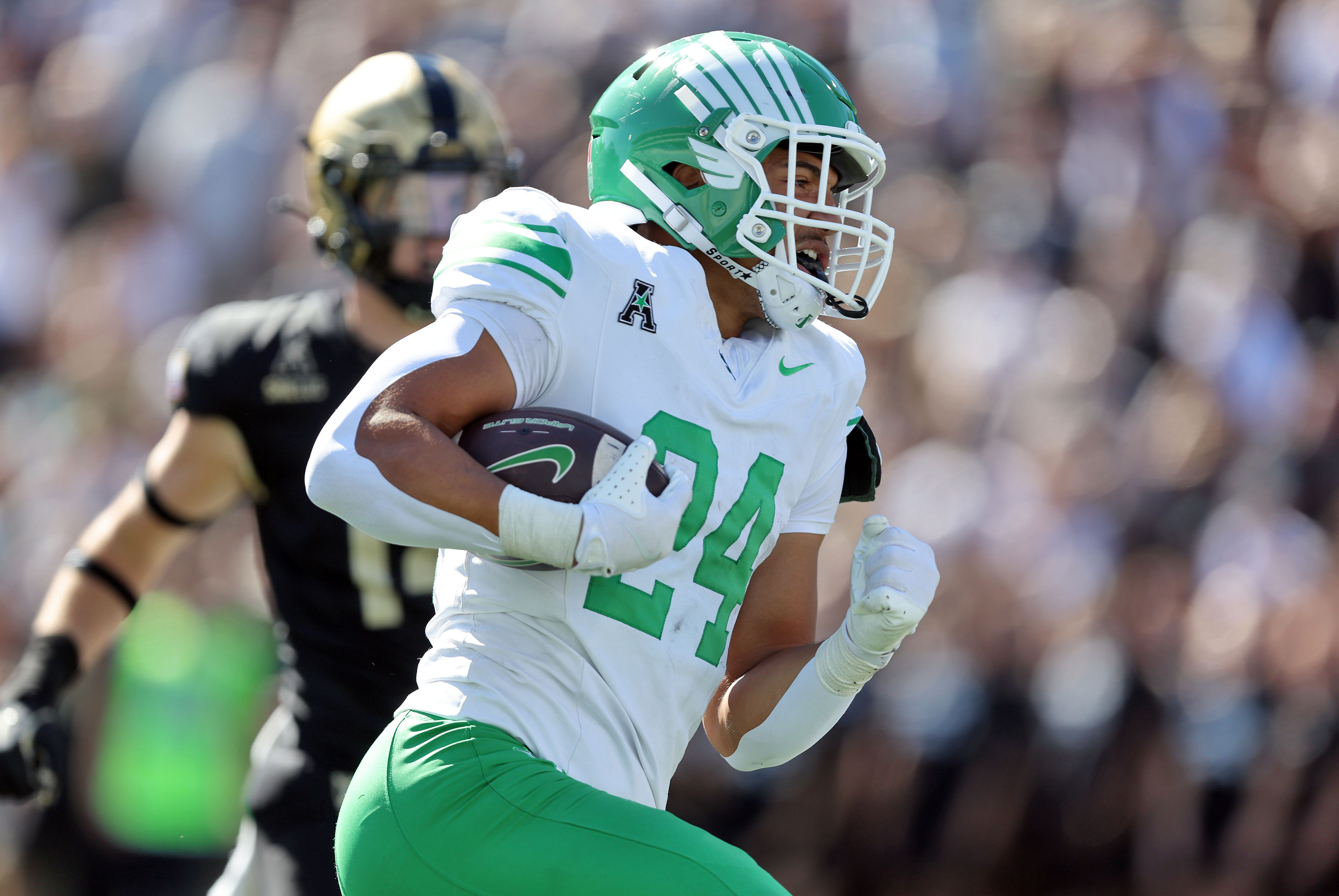 North Texas running back Caleb Hawkins (24) runs for a touchdown as we offer our North Texas vs. San Diego State predictions today.