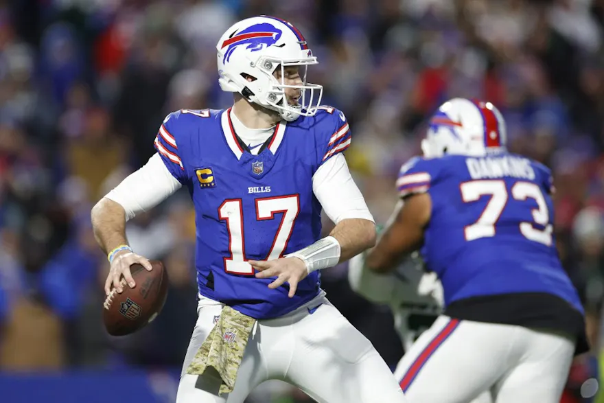 Josh Allen of the Buffalo Bills attempts a pass as part of our Week 12 NFL predictions for Bills vs. Eagles