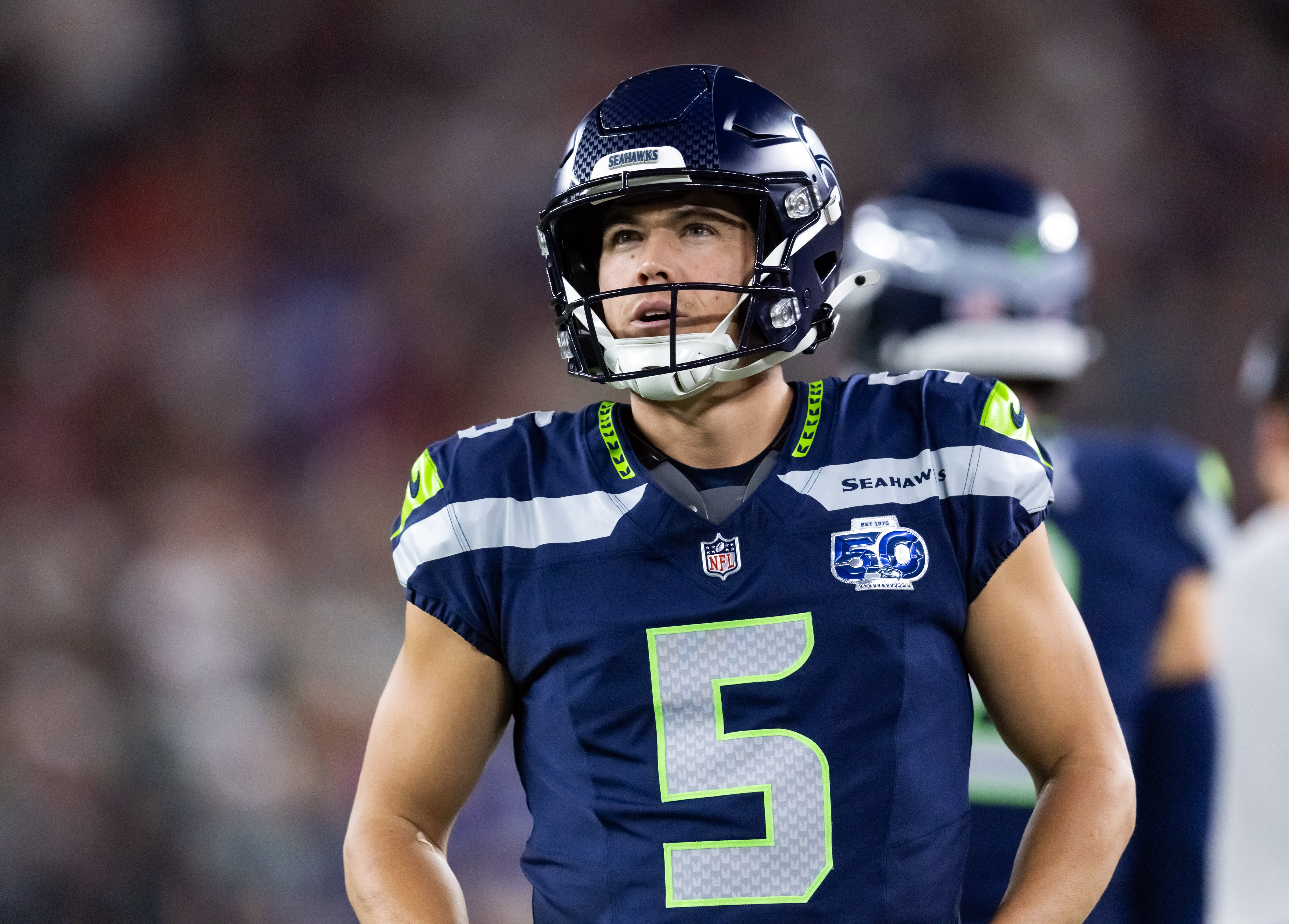 Seattle Seahawks kicker Jason Myers (5) looks on as explain how to bet on the Super Bowl opening kickoff odds.