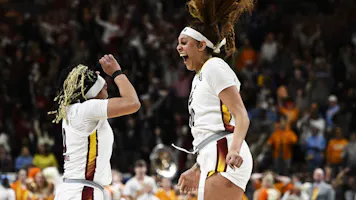Kamilla Cardoso #10 of the South Carolina Gamecocks celebrates with Te-Hina Paopao #0 as we look at the latest 2024 women's March Madness odds.