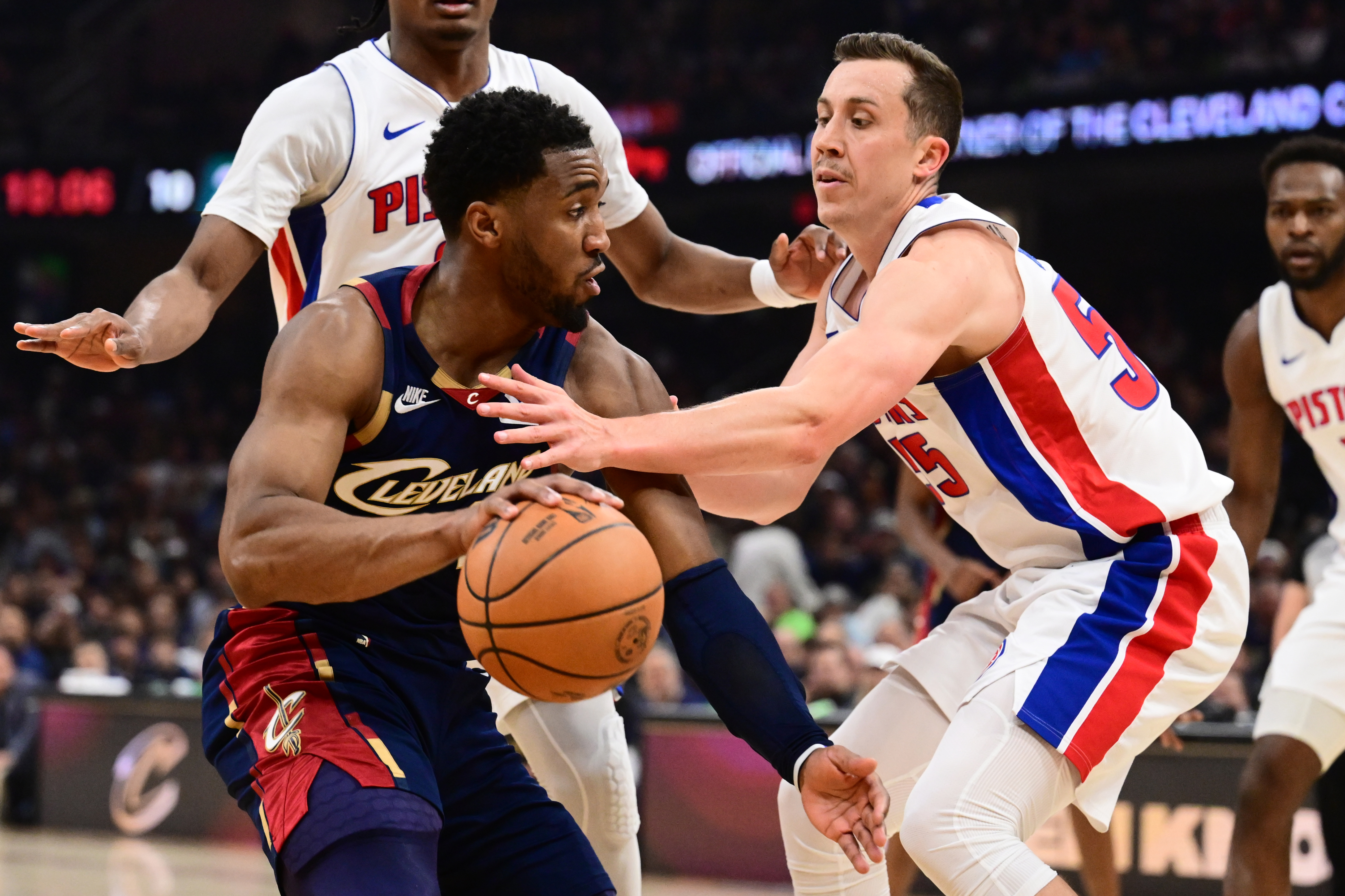 Cleveland Cavaliers guard Donovan Mitchell (45) drives to the basket against Detroit Pistons forward Duncan Robinson (55) as we provide our Cavaliers vs. Pistons player props today for Game 7.