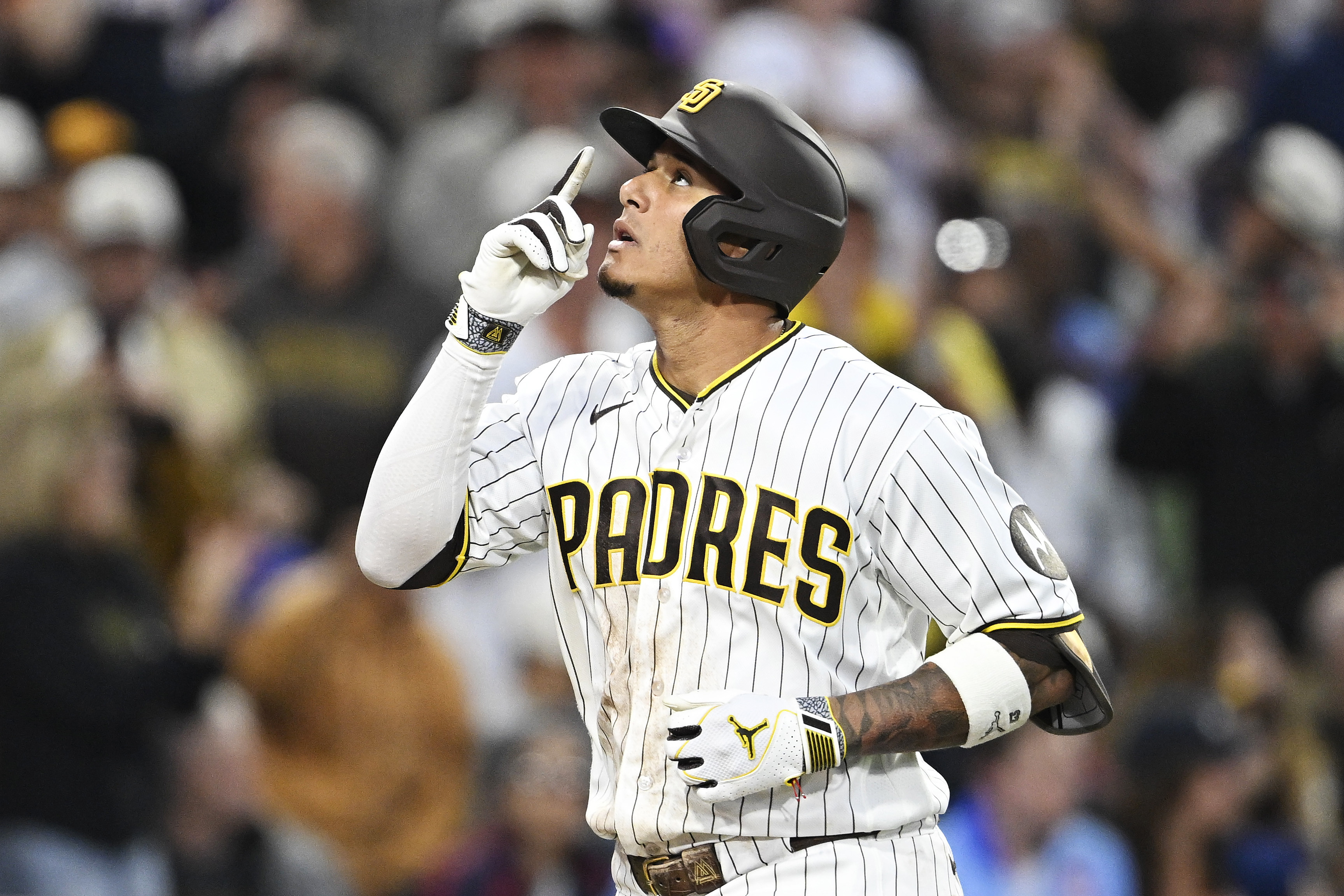 San Diego Padres third baseman Manny Machado (13) points skyward as we break down the Dodgers vs. Padres win probability.
