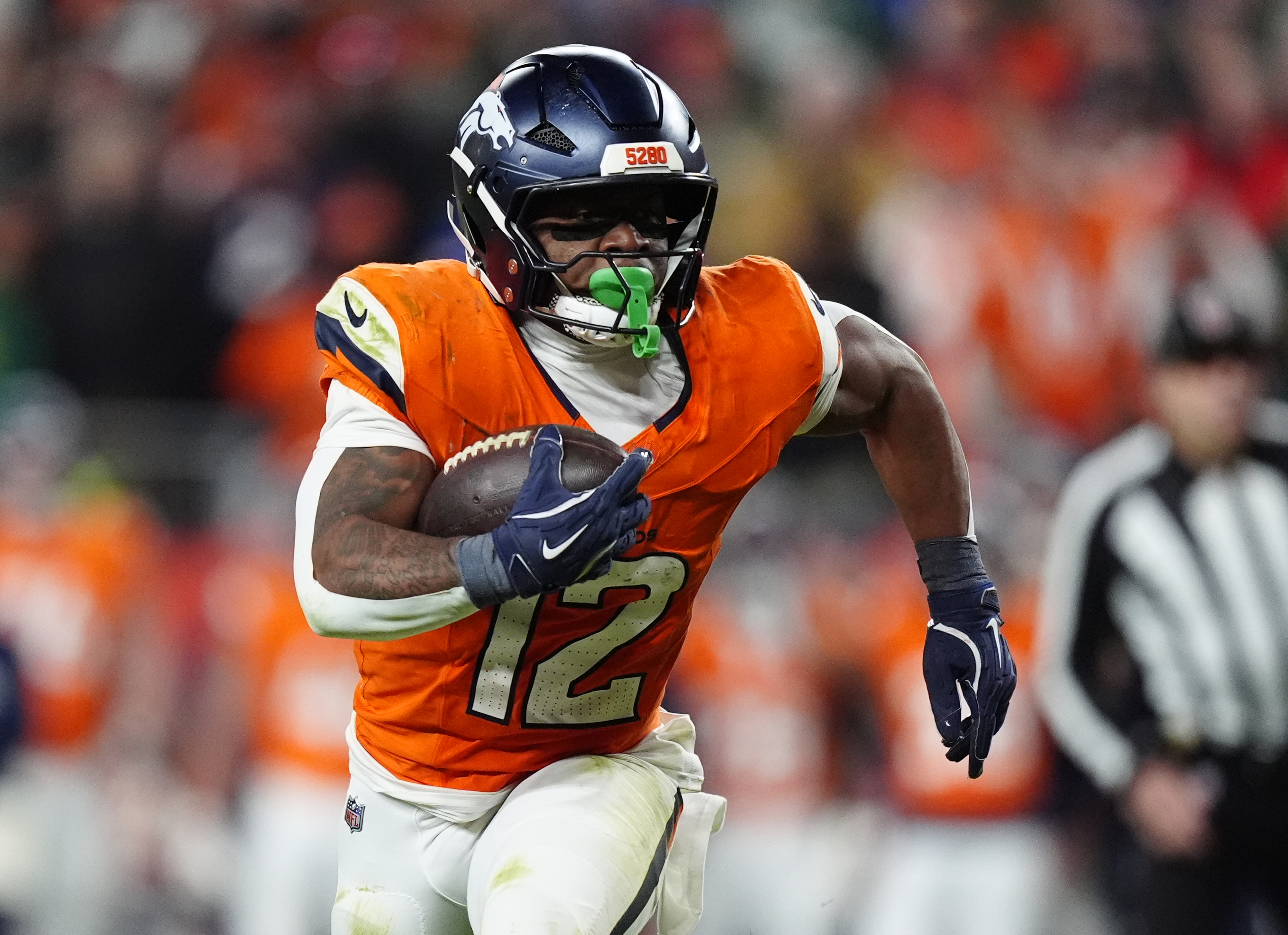 Denver Broncos running back RJ Harvey (12), seen here running, is featured in our anytime touchdown scorer predictions for Thursday Night Football.