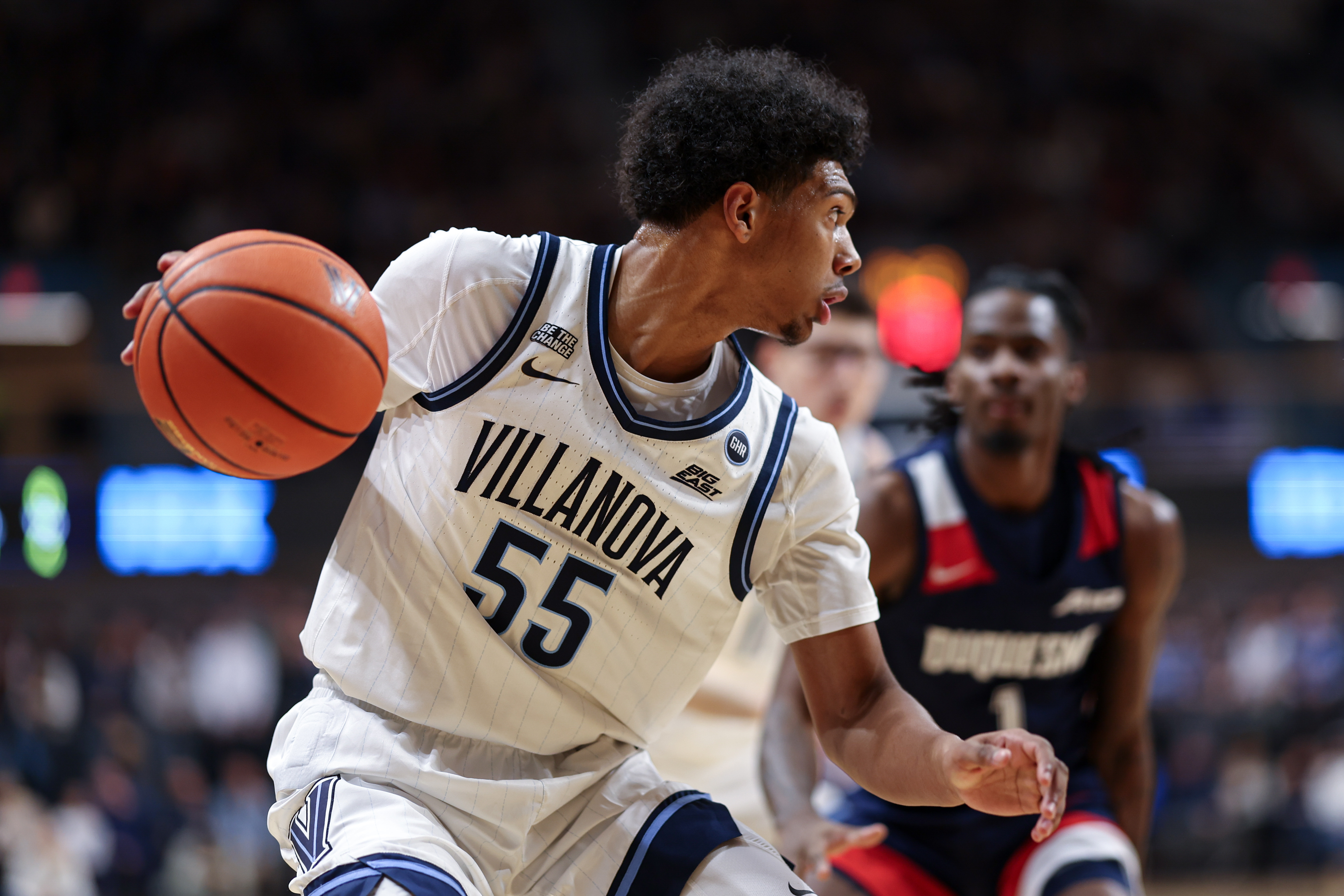 Villanova Wildcats guard Acaden Lewis controls the ball as we make our best Wisconsin vs. Villanova prediction.