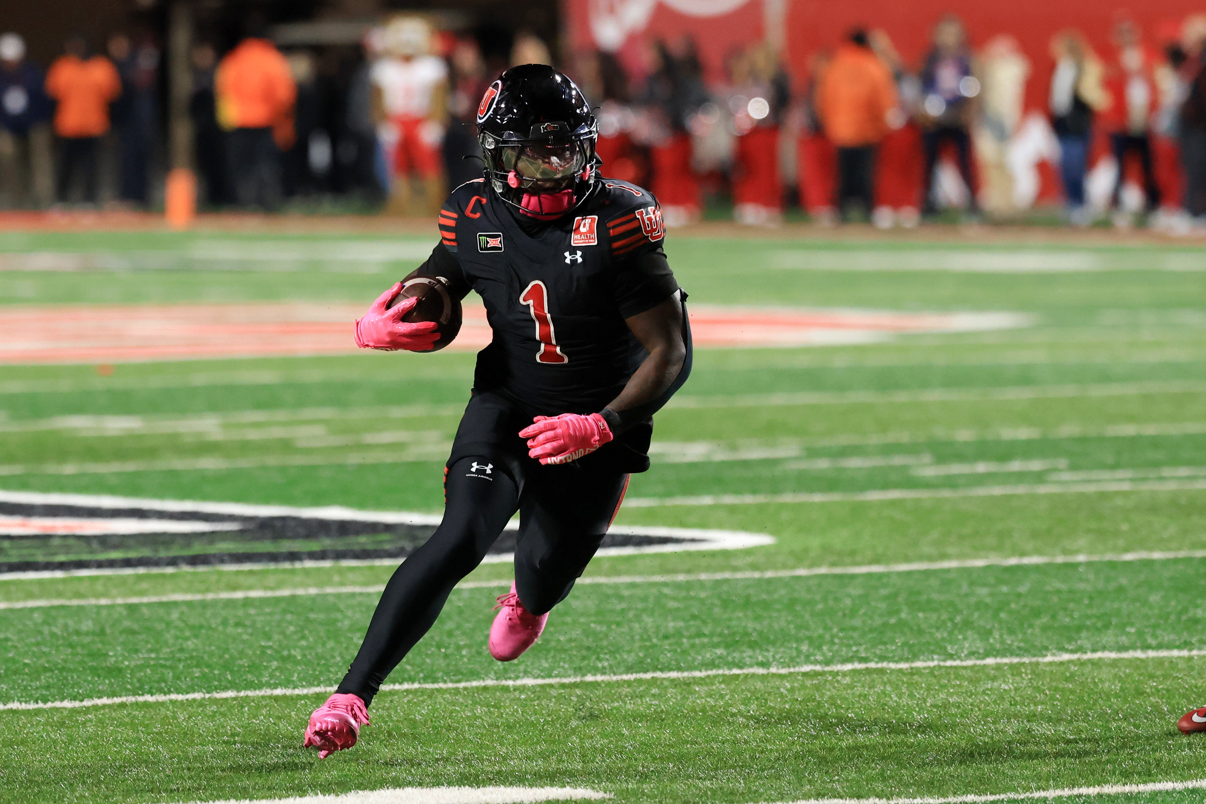 Utah Utes running back Wayshawn Parker rushes as we look at the CFTC and Justice Department bringing a lawsuit against Utah over prediction markets.