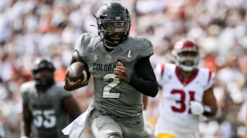 Shedeur Sanders of the Colorado Buffaloes rushes for a touchdown as we look at the early 2024 college football lines.