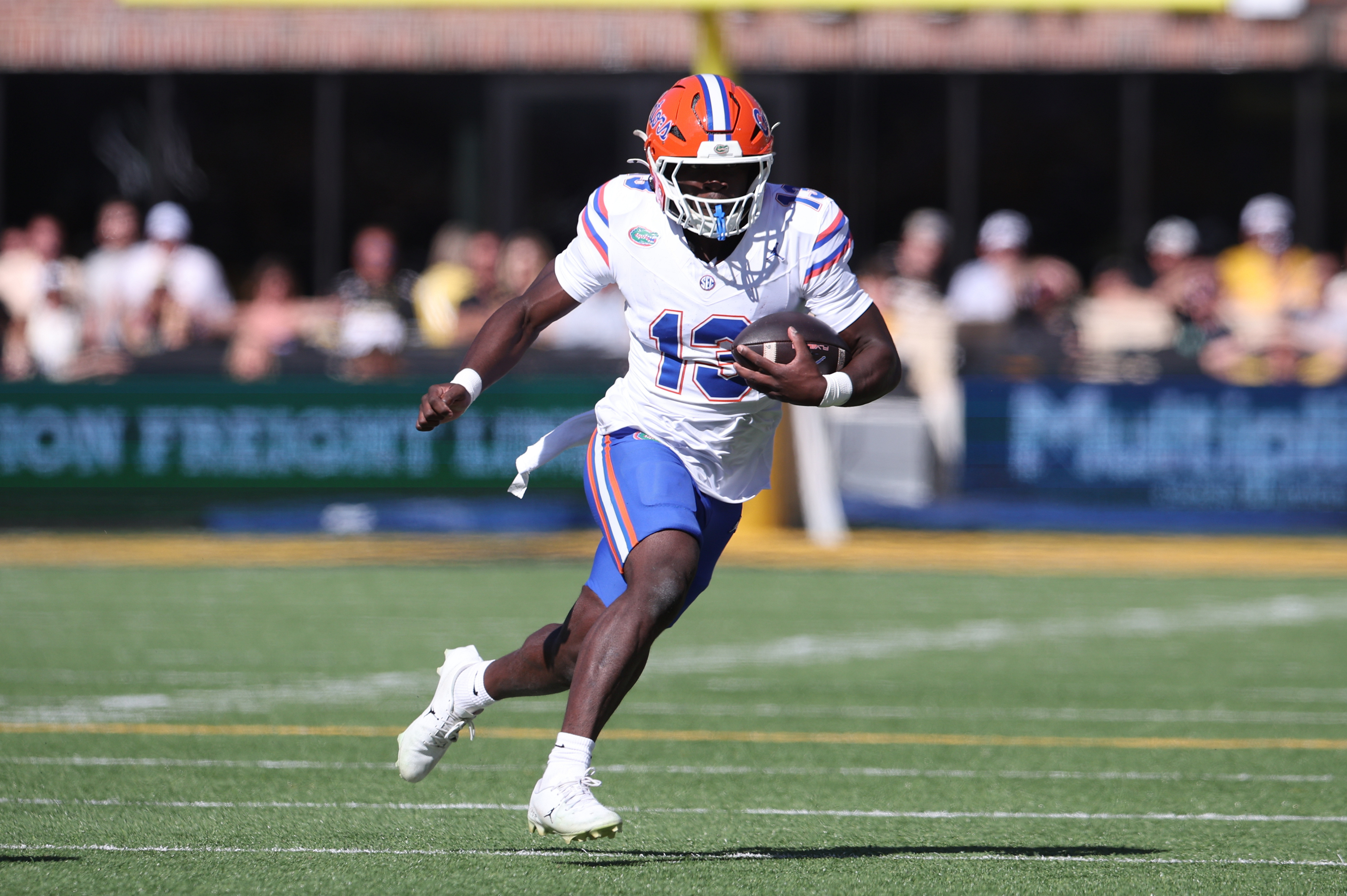 Florida Gators running back Jadan Baugh (13) carries the ball as he is featured in our South Carolina vs. Florida prediction.