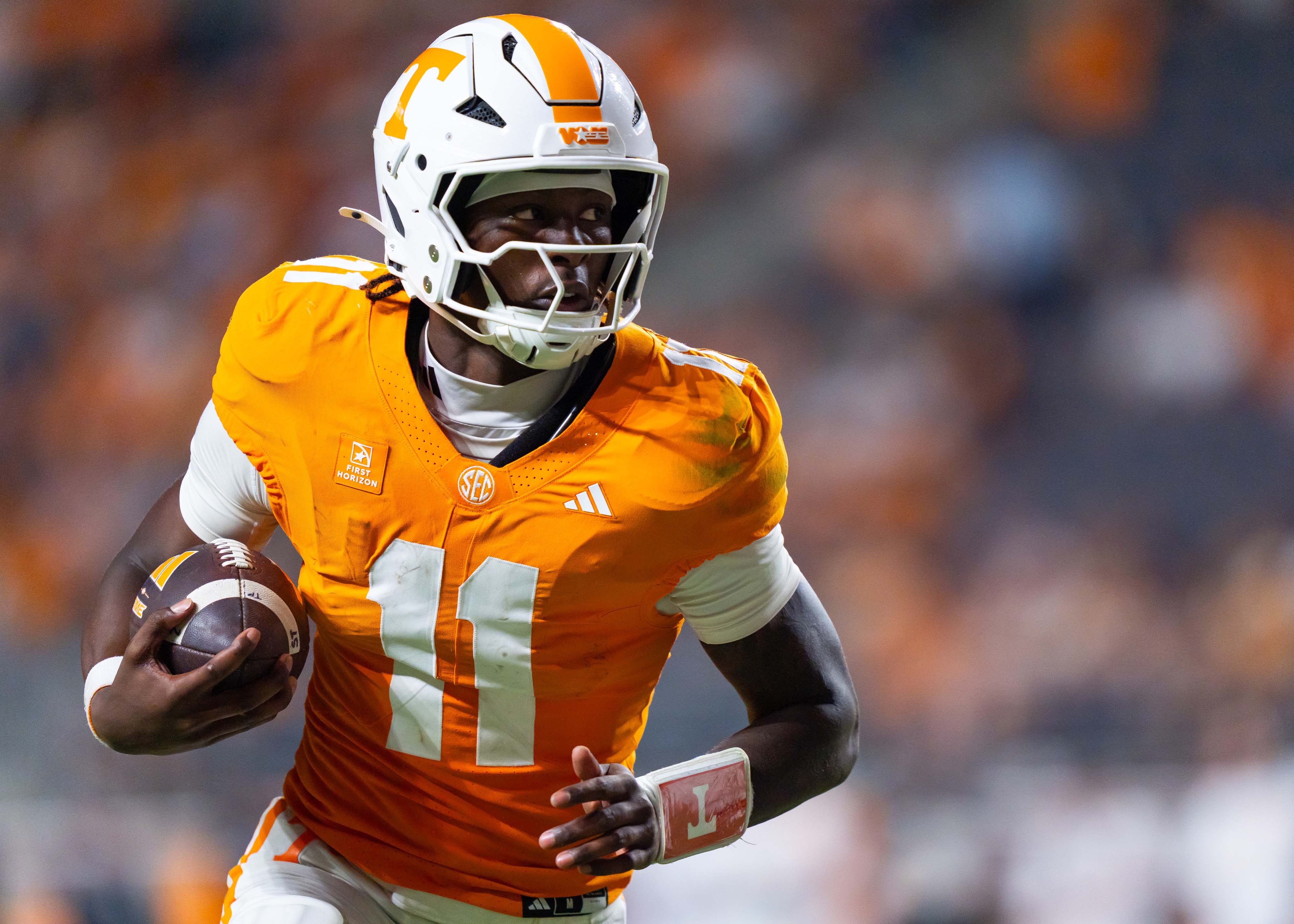 Faizon Brandon #11 of the Tennessee Volunteers runs the ball as he is featured in our Tennessee vs. Texas expert picks.