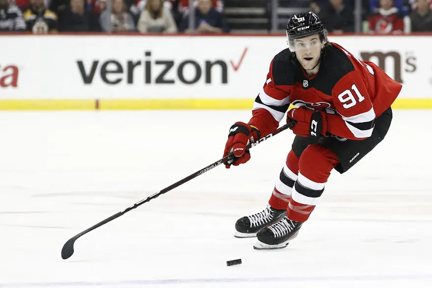 Dawson Mercer #91 of the New Jersey Devils controls the puck as we look at New Jersey's November legal sports betting financials.