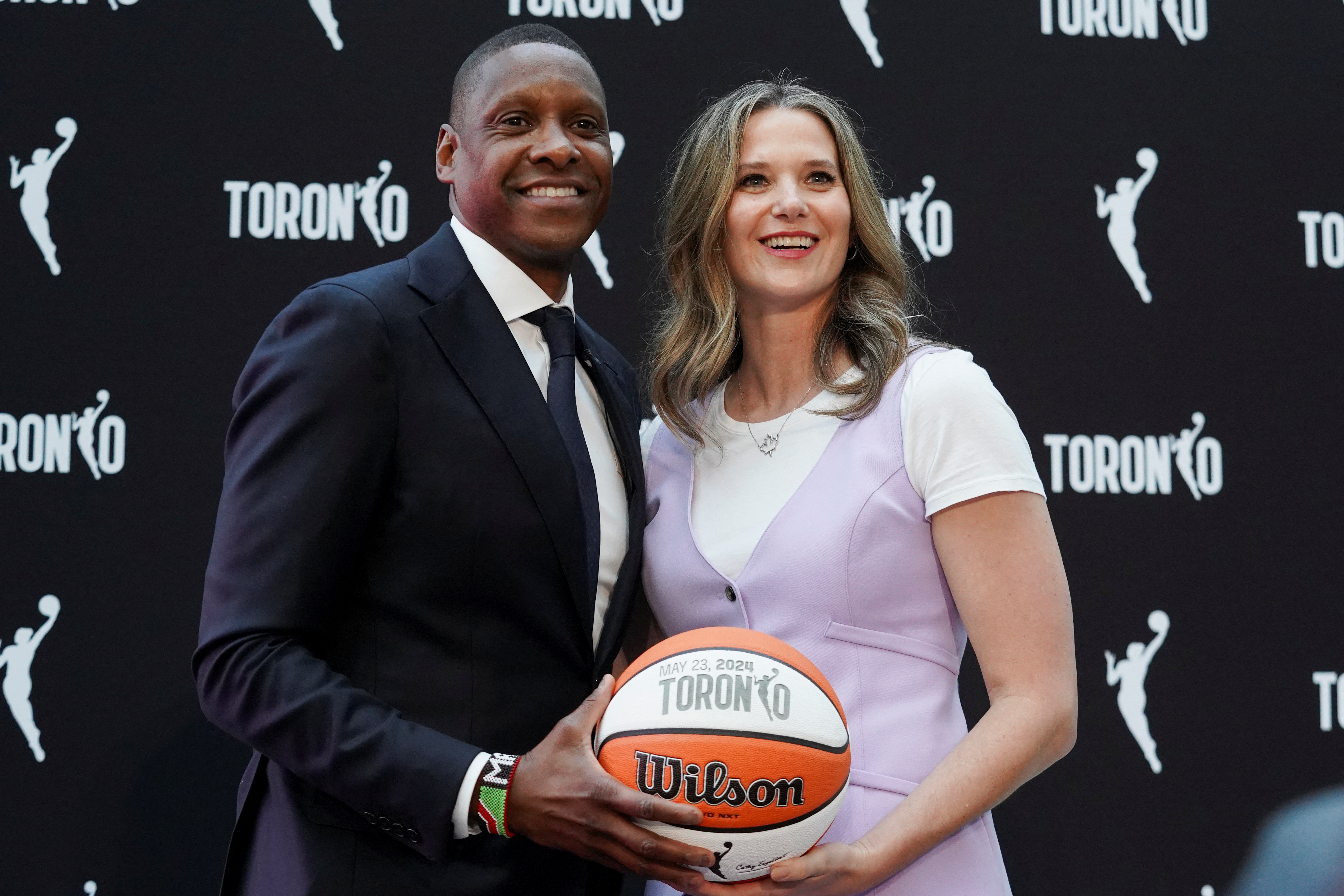 Masai Ujiri and Teresa Resch pose following a press conference announcing the WNBA's expansion into Canada, featured in our WNBA expansion draft guide.