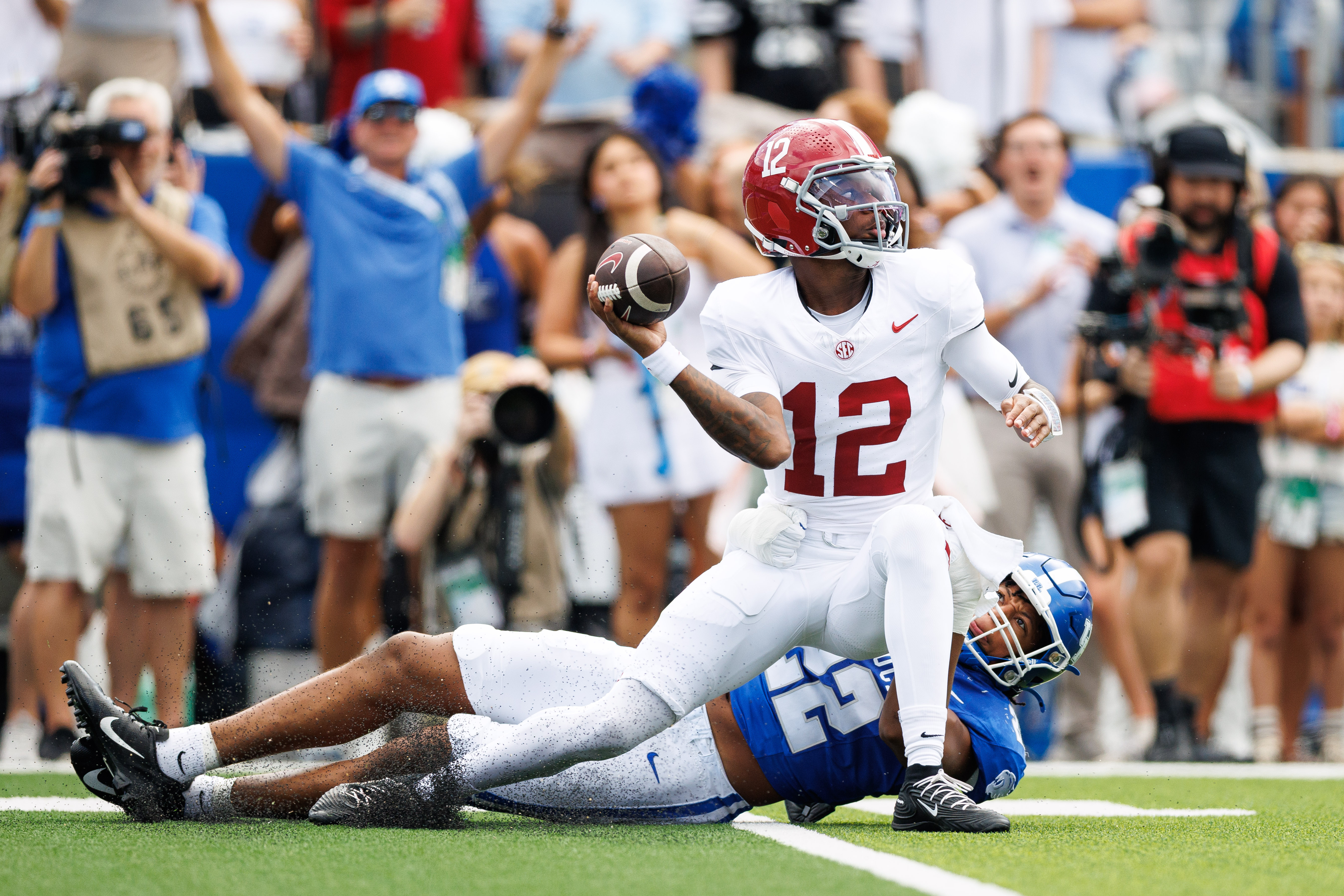 Alabama Crimson Tide quarterback Keelon Russell throws a pass under pressure as we make our best Florida State vs. Alabama prediction