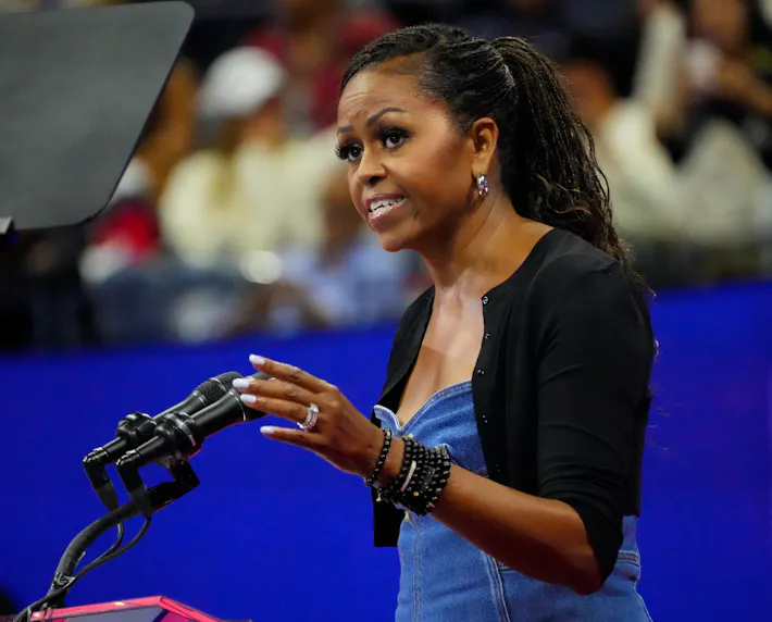 Former First Lady Michelle Obama greets the crowd on Day 1 of the 2023 U.S. Open tennis tournament at USTA Billie Jean King National Tennis Center as we look at the Michelle Obama presidential odds.