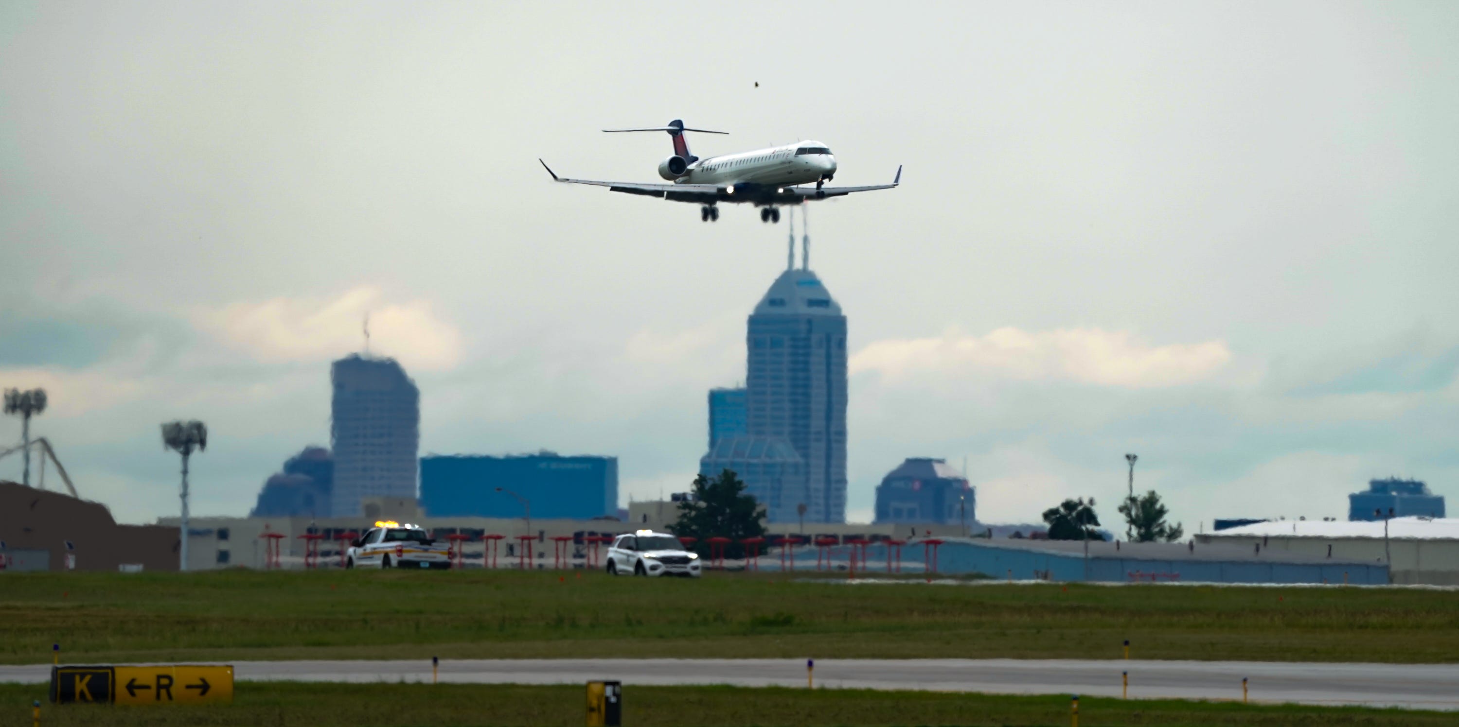 An airplane lands as we look at FlightAware suing Kalshi.