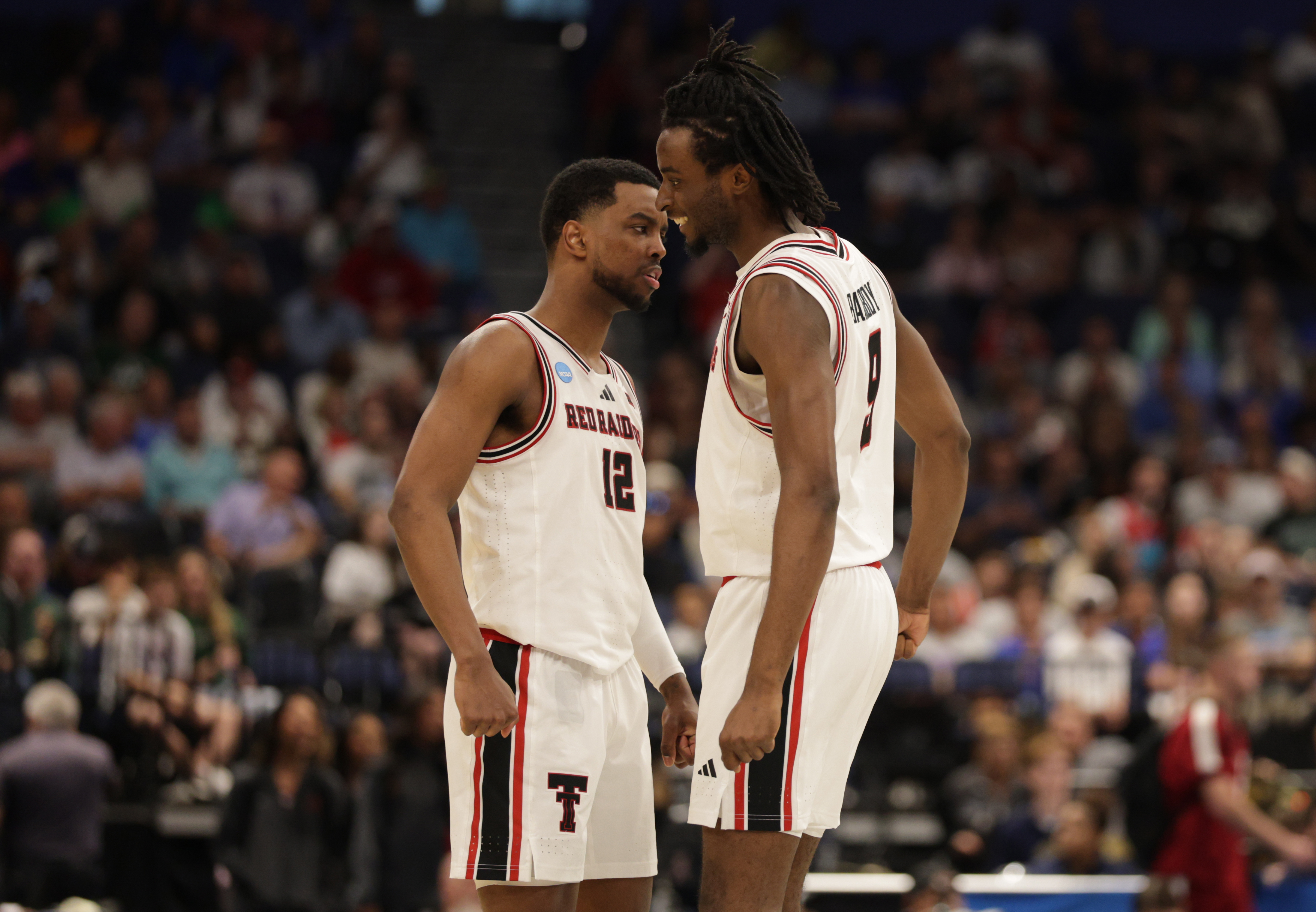 Texas Tech Red Raiders forward Donovan Atwell (12) and forward Luke Bamgboye (9) celebrate as we break down our Texas Tech vs. Alabama prediction.