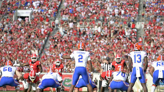 Florida quarterback DJ Lagway (2) takes the snap against Georgia, with this year's World's Largest Outdoor Cocktail Party leading our college football predictions for Week 10.