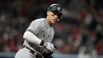 Aaron Judge of the New York Yankees hits a home run during the third inning against the Cleveland Guardians in Game 3 of the American League Division Series at Progressive Field.