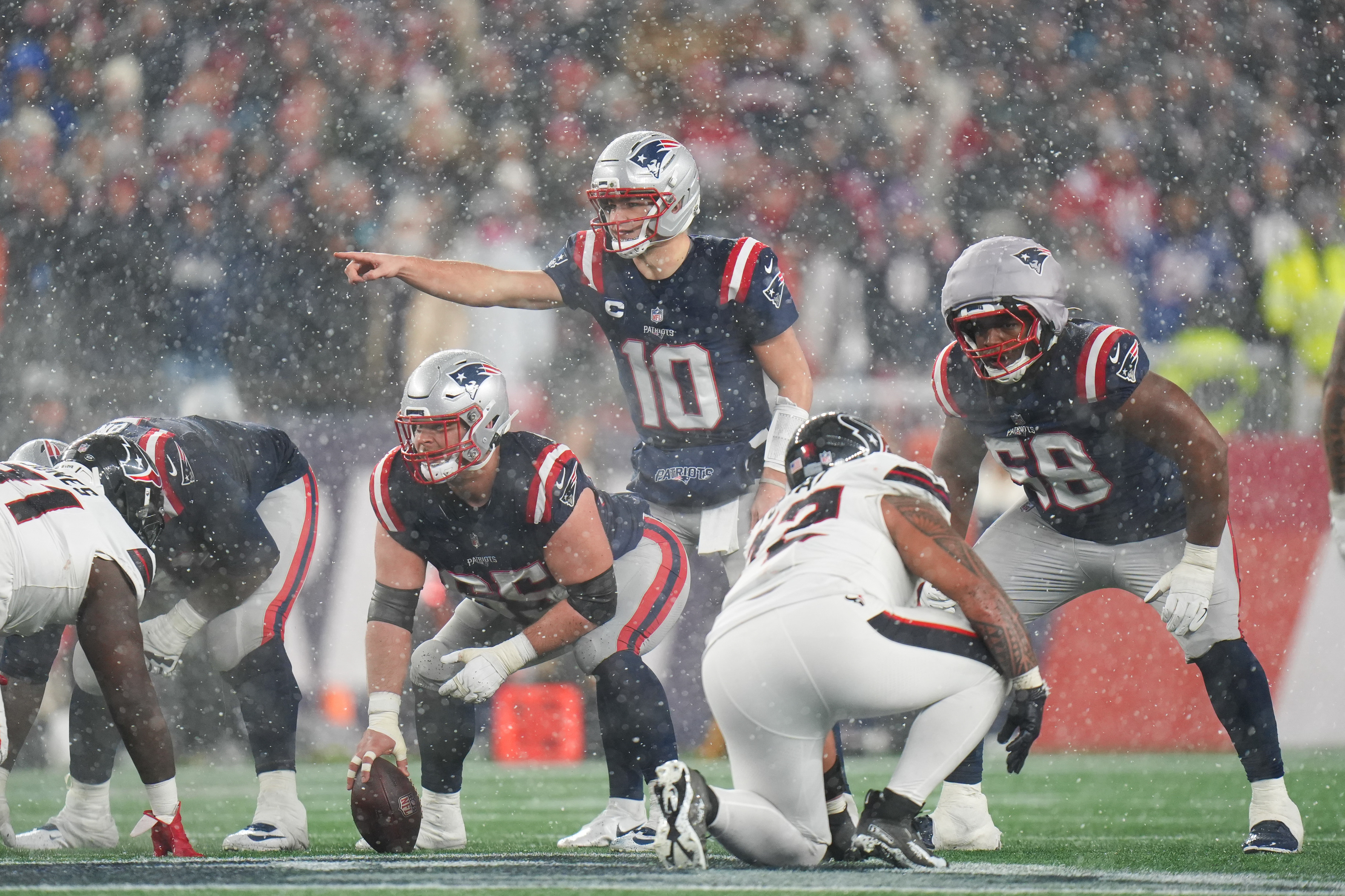 New England Patriots quarterback Drake Maye (10) communicates with his team as we break down the AFC Championship odds for Patriots vs. Broncos next Sunday.