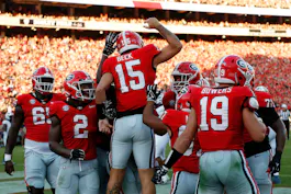 Georgia quarterback Carson Beck celebrates with his teammates after scoring a touchdown during the first half of a game against UT Martin. Beck leads the 2024 Heisman Trophy Odds.
