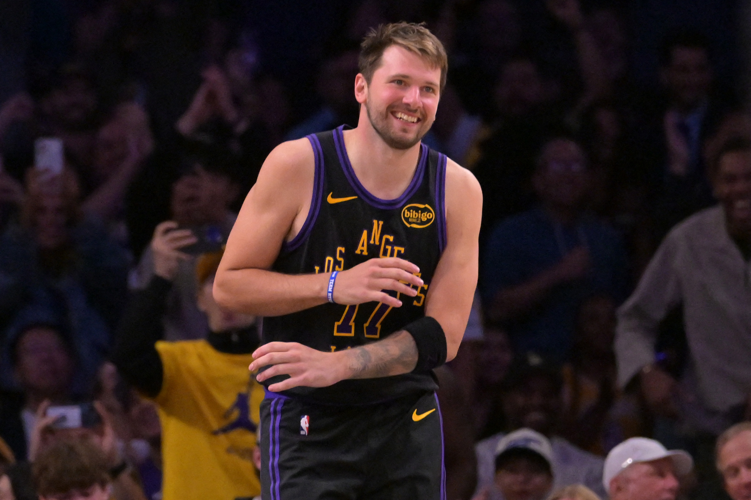 Los Angeles Lakers guard Luka Doncic (77) smiles after a dunk as we break down our NBA Play of the Day.