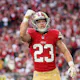 Running back Christian McCaffrey of the San Francisco 49ers celebrates after scoring a five-yard rushing touchdown against the Arizona Cardinals as we look at our Super bowl anytime touchdown scorer prop picks.