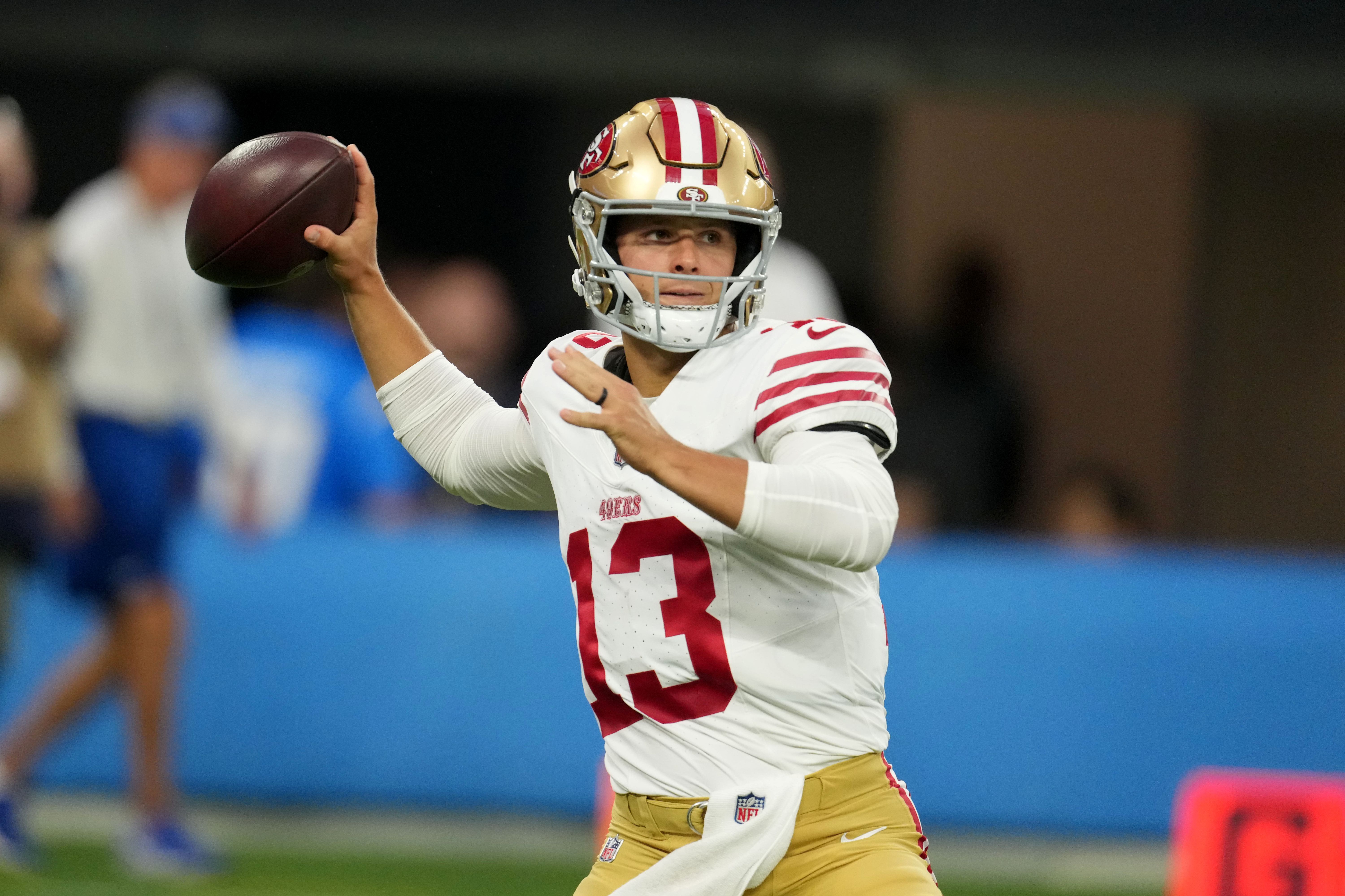 San Francisco 49ers quarterback Brock Purdy throws the ball as we make our best 49ers vs. Rams expert picks