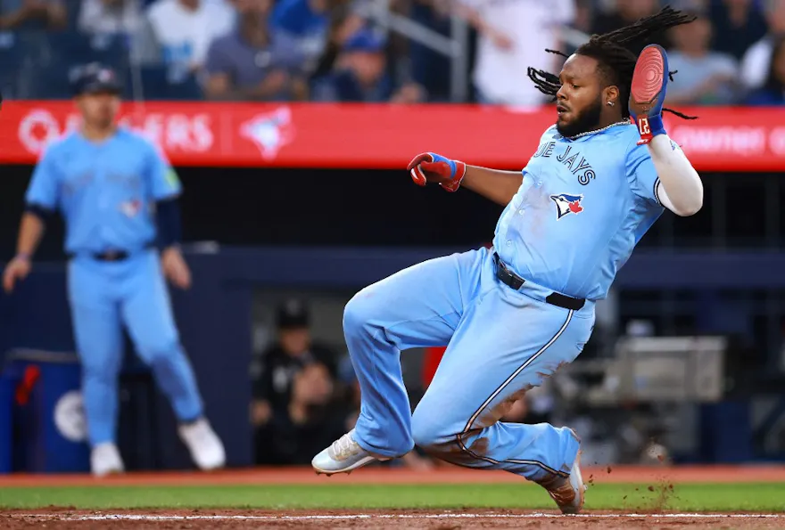 Vladimir Guerrero Jr. of the Toronto Blue Jays slides into home as we look at the results of a battle to control Ontario's sports betting industry