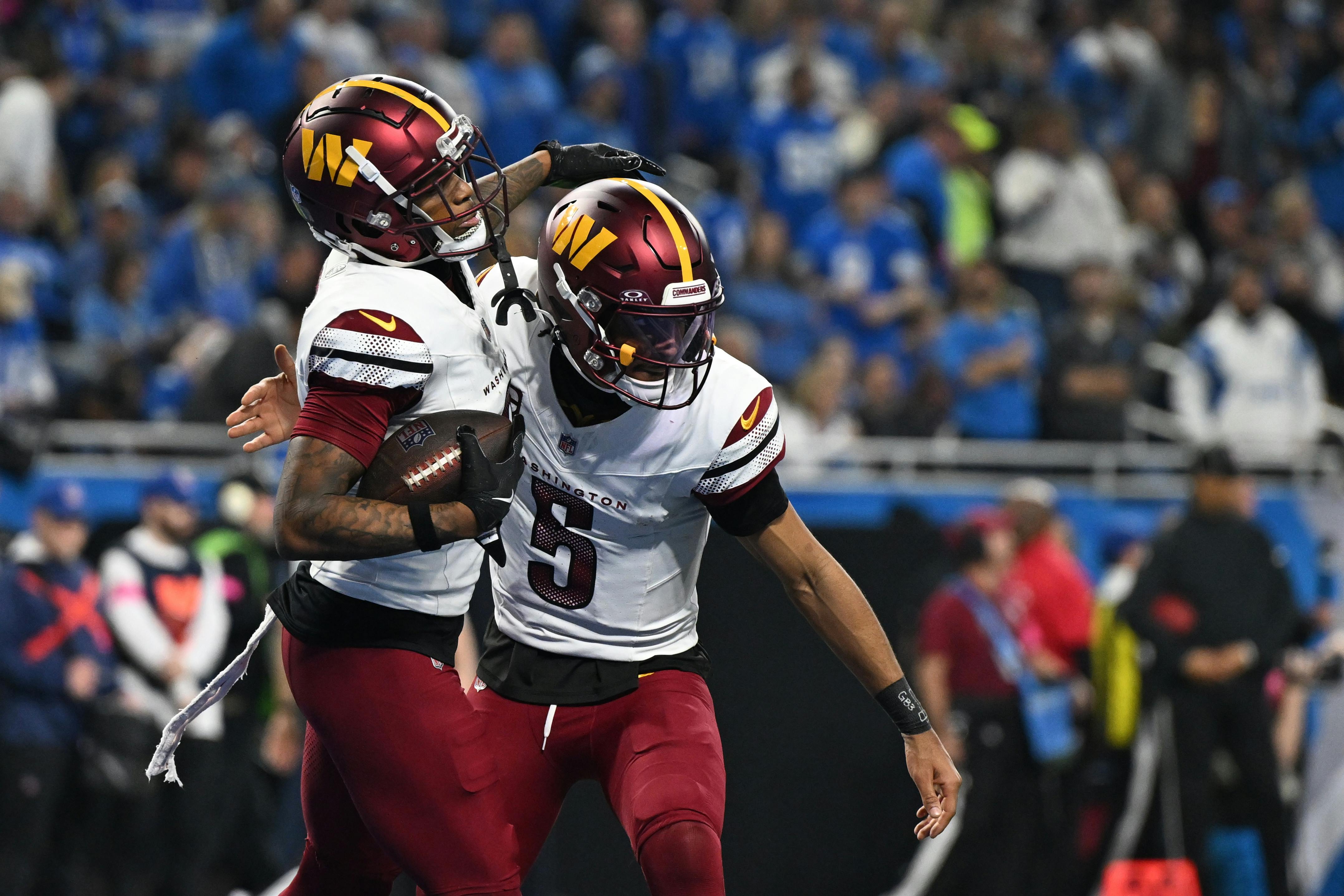 Pictured: Washington Commanders tight end Zach Ertz (86) celebrates a touchdown pass with quarterback Jayden Daniels (5) as we break down the Commanders Super Bowl odds and where they rank among the biggest long shots in NFL history.