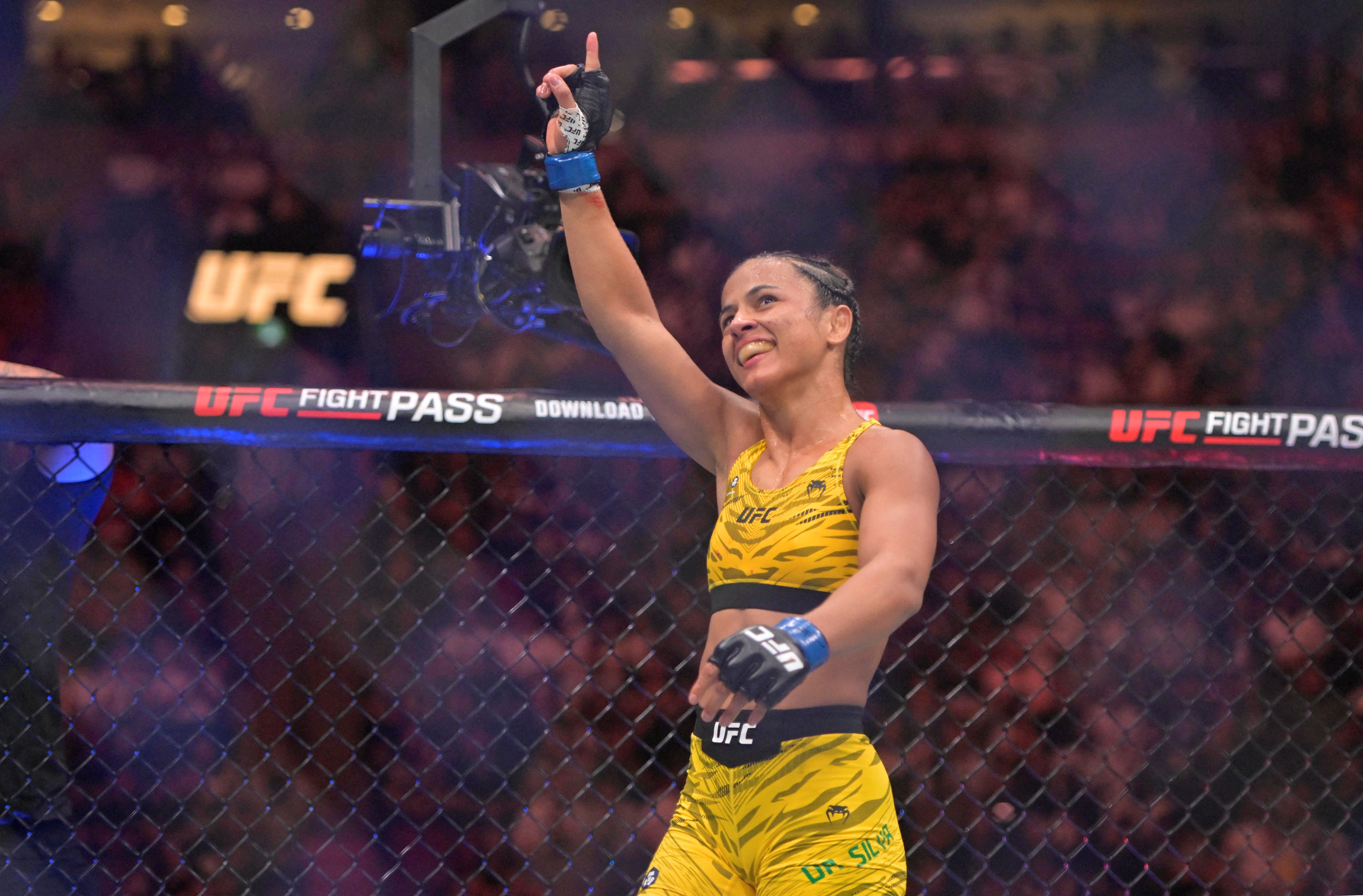 Natalia Silva (blue gloves) reacts as we break down the Natalia Silva vs. Rose Namajunas odds.