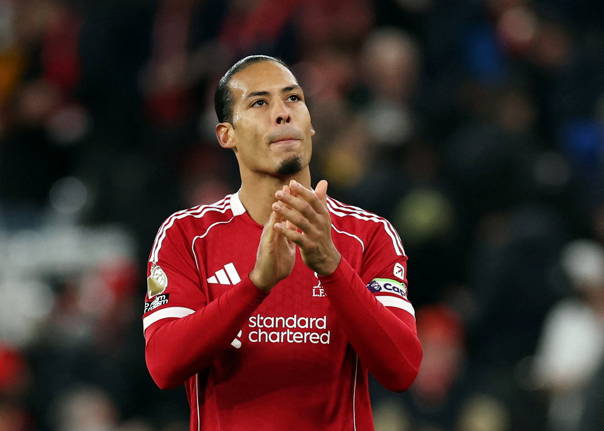 Liverpool's Virgil van Dijk applauds fans as we make our best Wolves vs. Liverpool prediction & parlay.