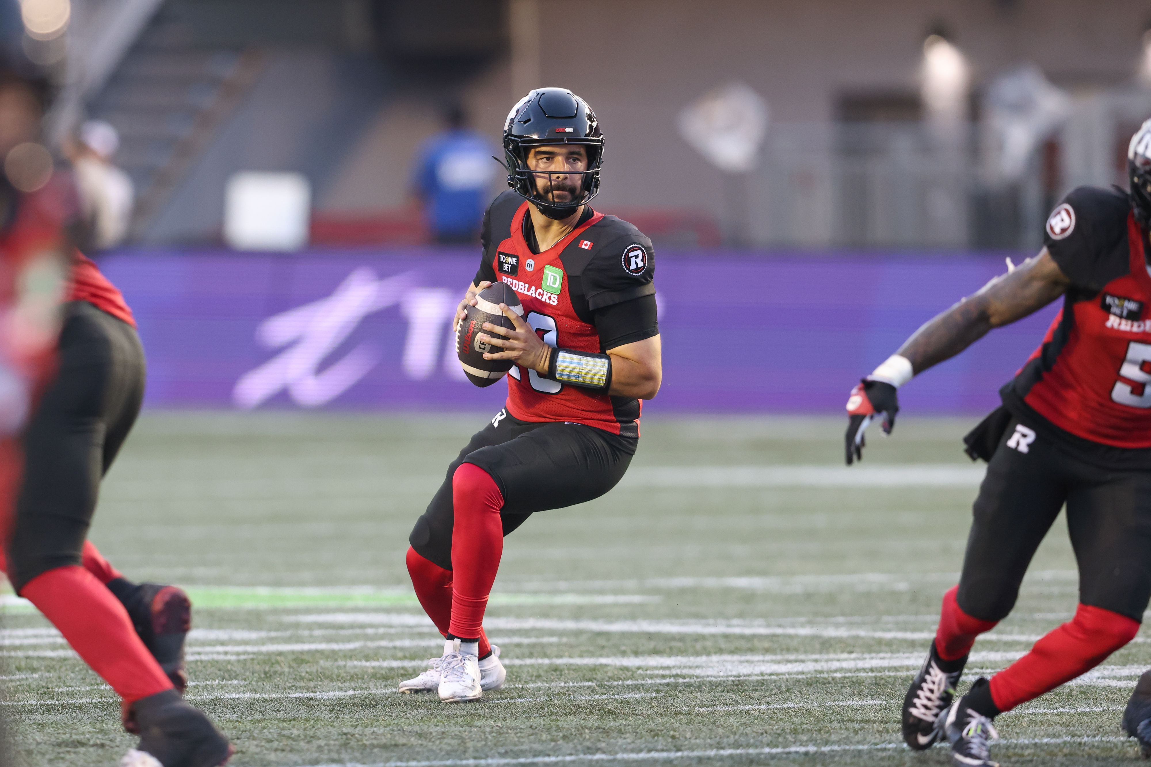 Ottawa Redblacks quarterback Jake Maier (13) sets up to pass as we break down our Blue Bombers vs. Redblacks prediction.