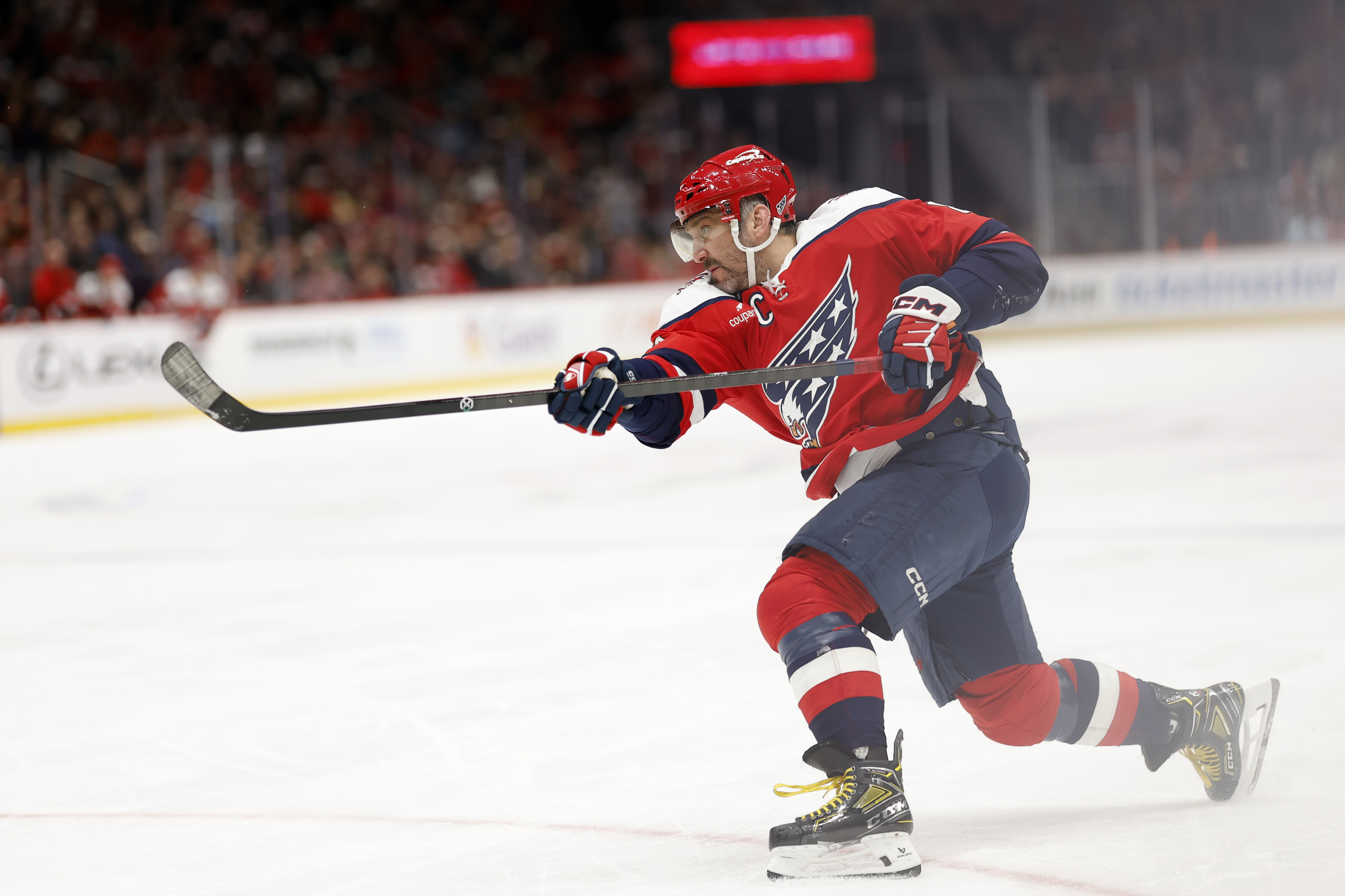 Washington Capitals forward Alex Ovechkin (8) shoots the puck as we offer our NHL anytime goal scorer predictions today.