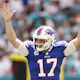Josh Allen of the Buffalo Bills celebrates after a rushing touchdown by Devin Singletary during the first quarter against the Miami Dolphins at Hard Rock Stadium on September 19, 2021 in Miami Gardens, Florida.
