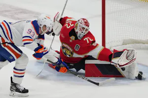 Edmonton Oilers forward Ryan Nugent-Hopkins shoots against Florida Panthers goaltender Sergei Bobrovsky during the first period in Game 1 of the 2024 Stanley Cup Final at Amerant Bank Arena. Bobrovsky leads the Conn Smythe Trophy Odds. 