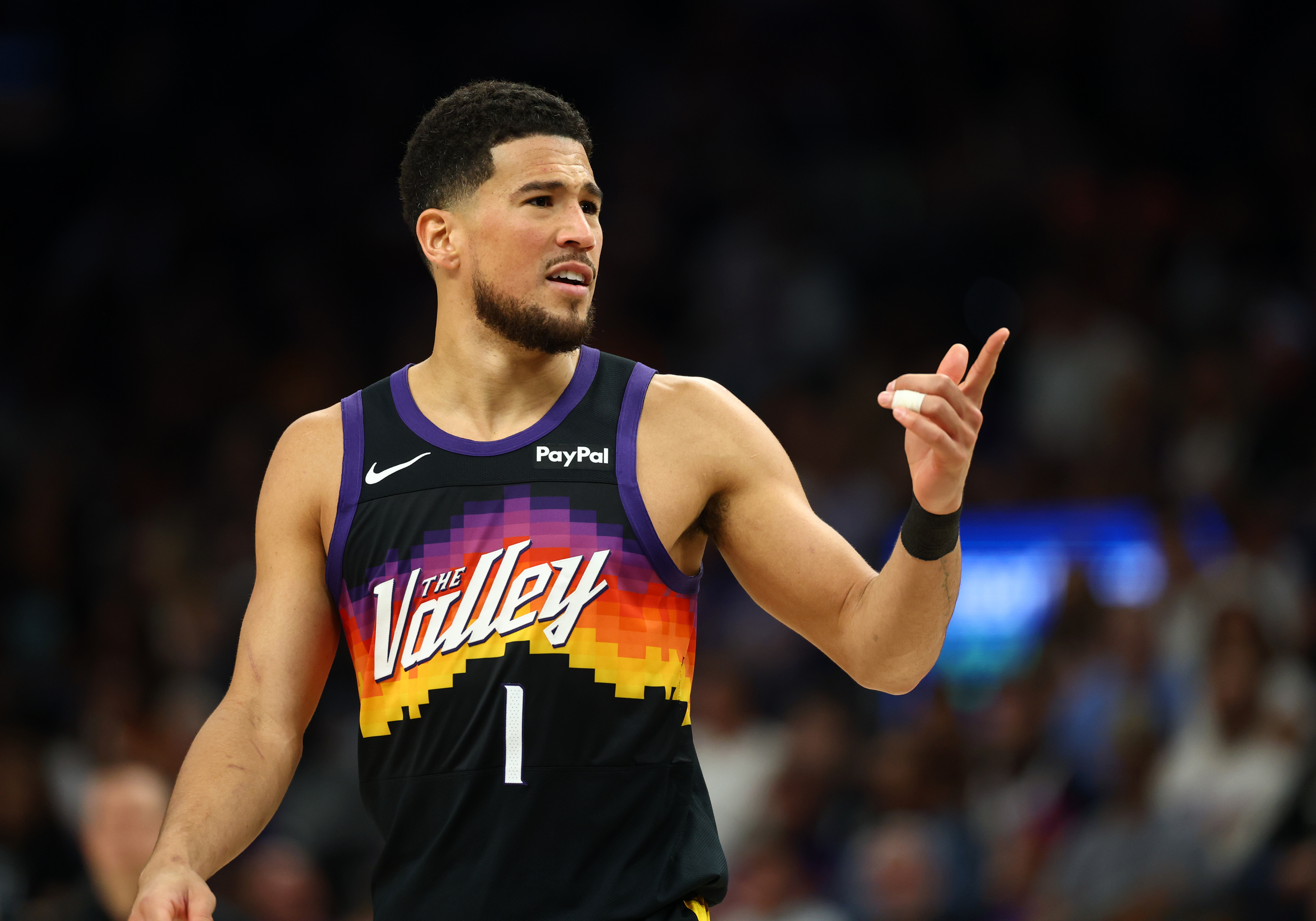 Phoenix Suns guard Devin Booker (1), seen here during a game, is featured in our NBA player props today.