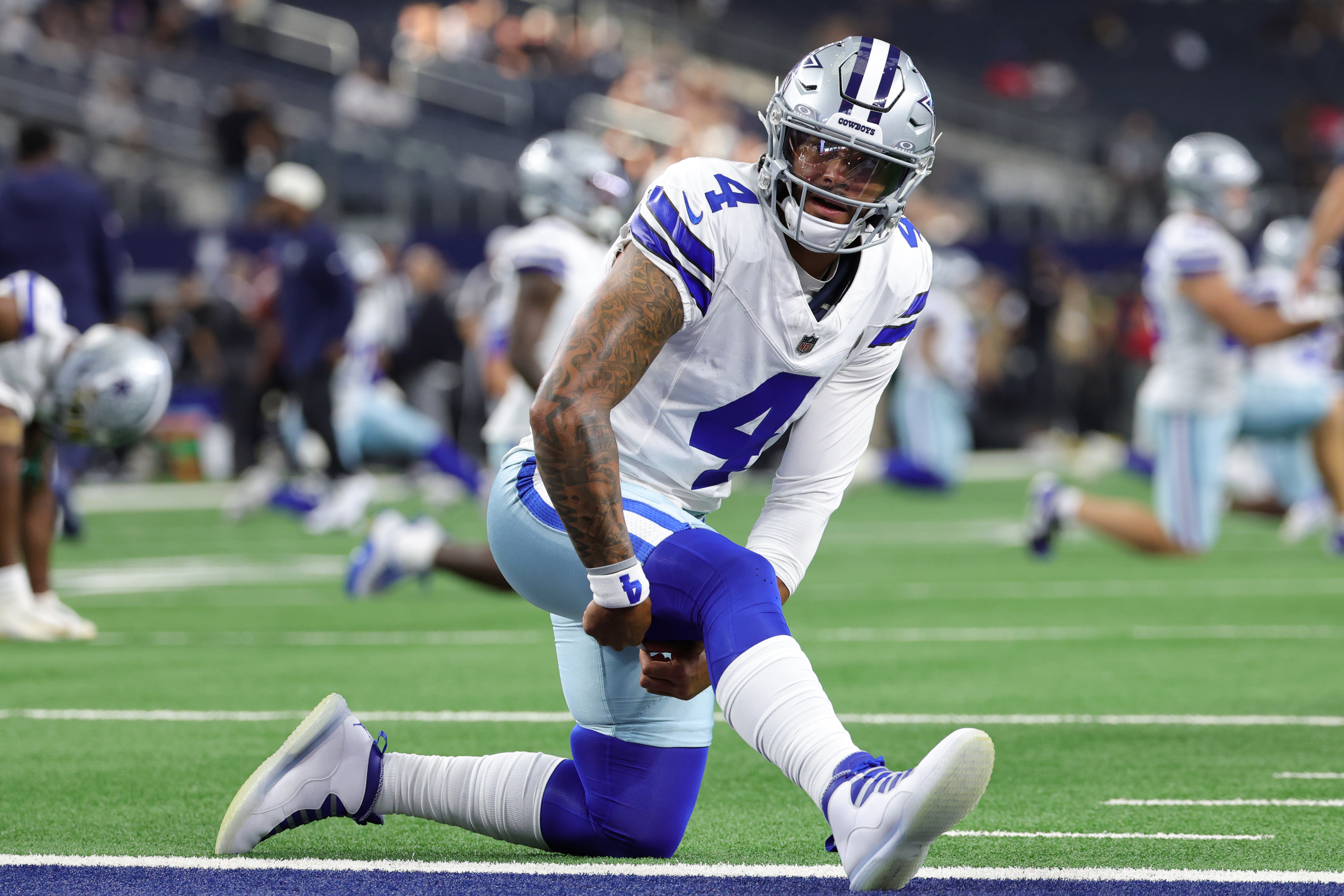 Dallas Cowboys quarterback Dak Prescott warms up for a game as we make our best Cowboys vs. Giants early prediction.