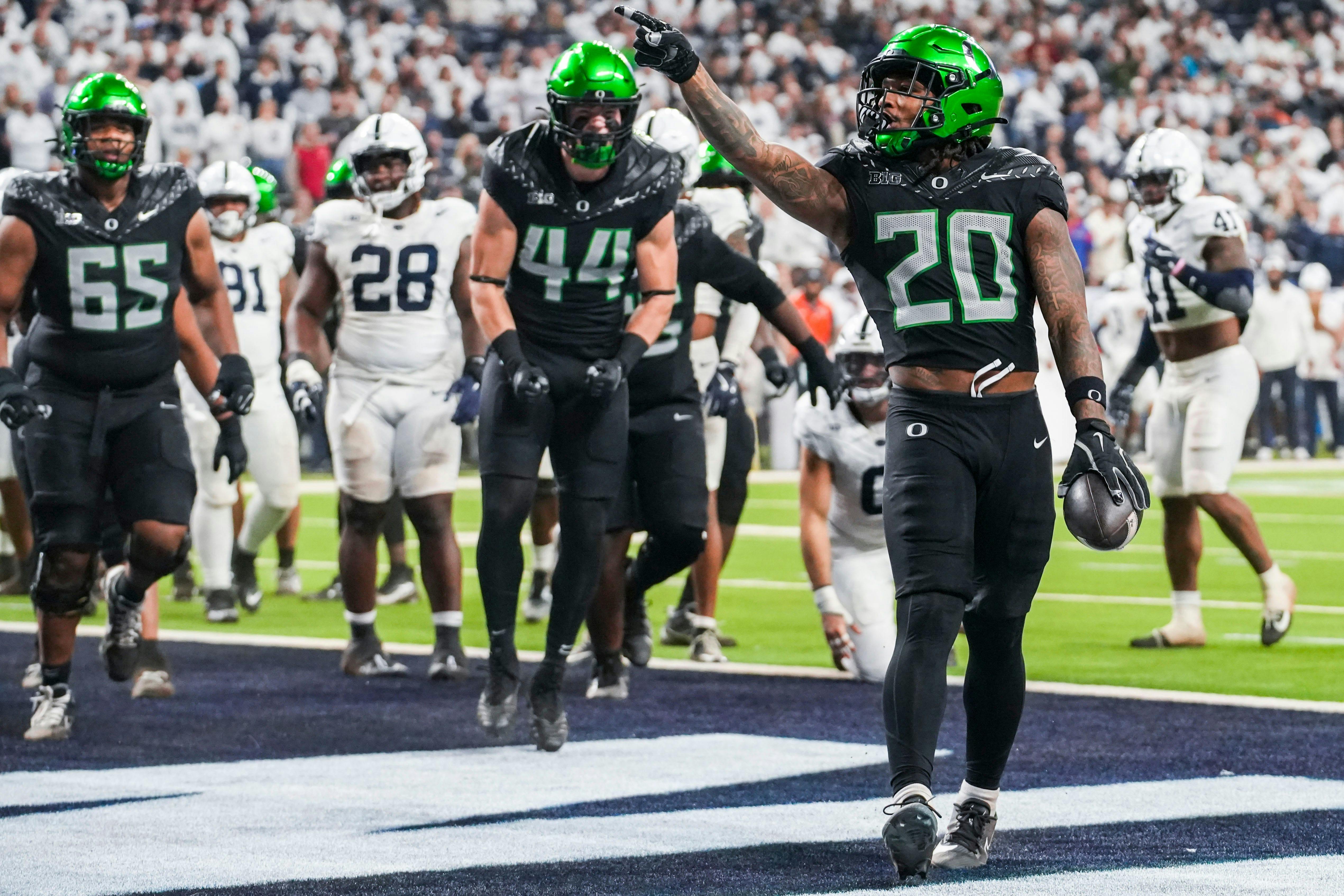 Oregon running back Jordan James celebrates a touchdown against Penn State. The Ducks lead the college football championship odds.