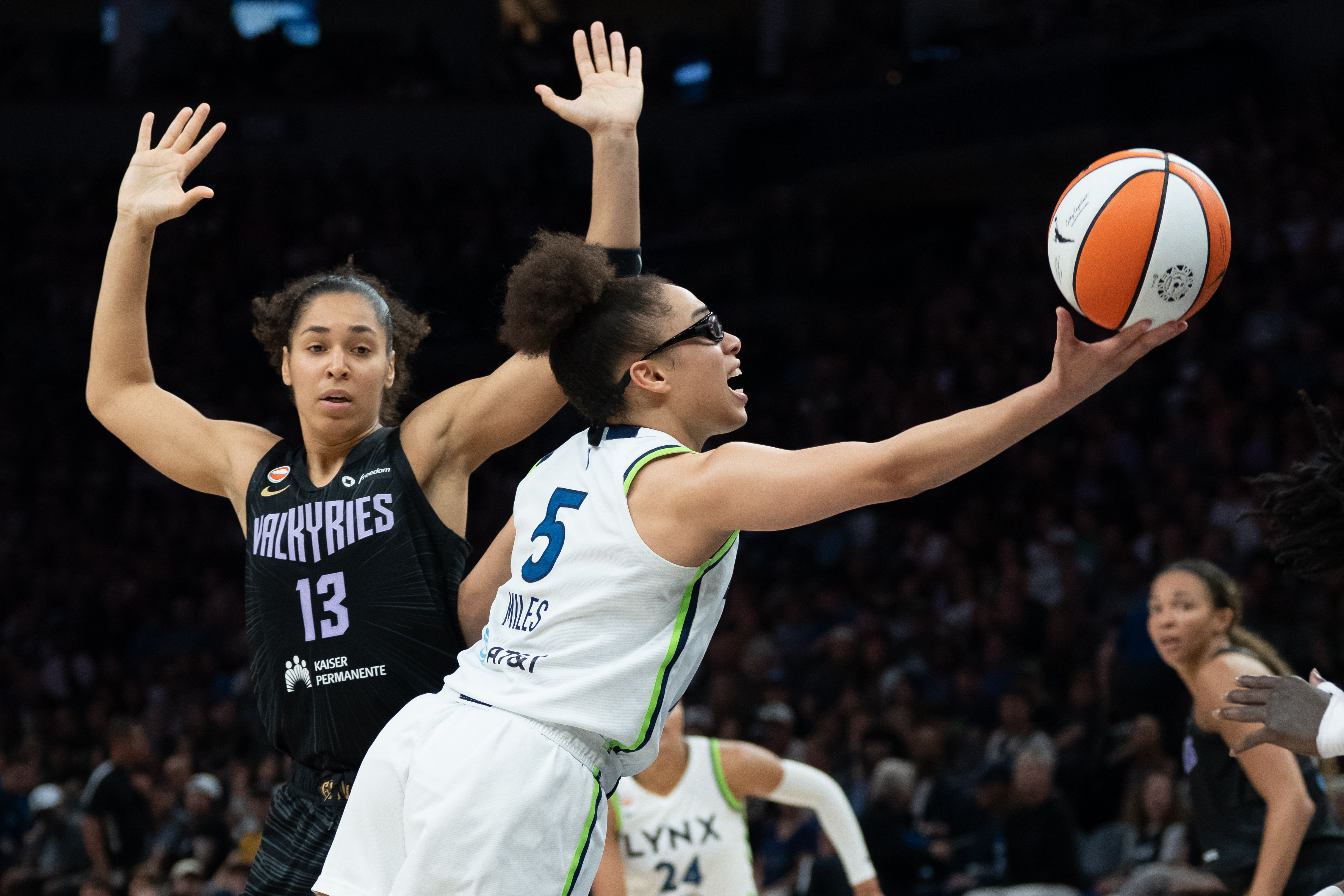 Minnesota Lynx guard Olivia Miles (5) shoots the ball as she is featured in our Lynx vs. Dream prediction.