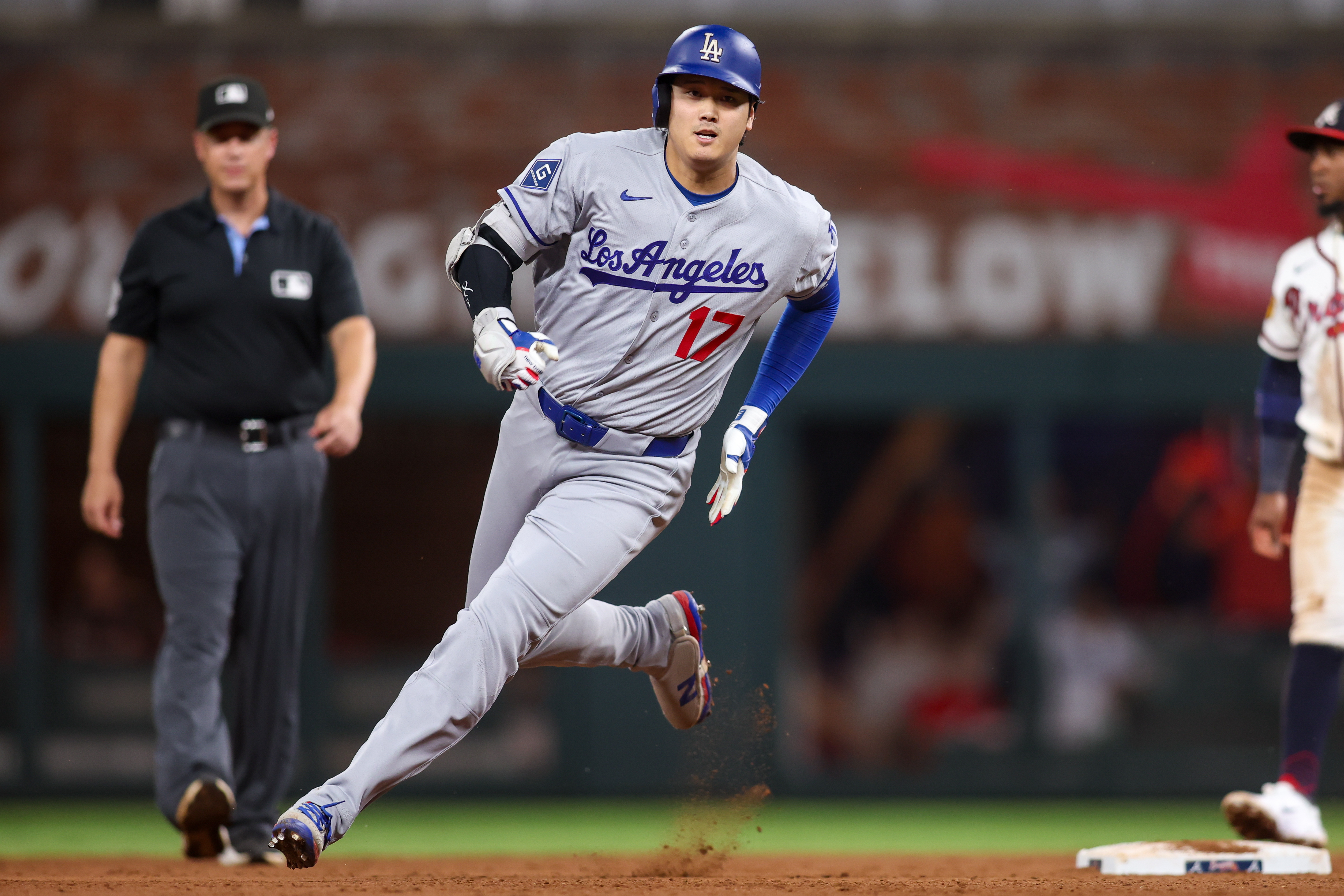  Los Angeles Dodgers designated hitter Shohei Ohtani runs as we make our best Dodgers vs. Braves prediction