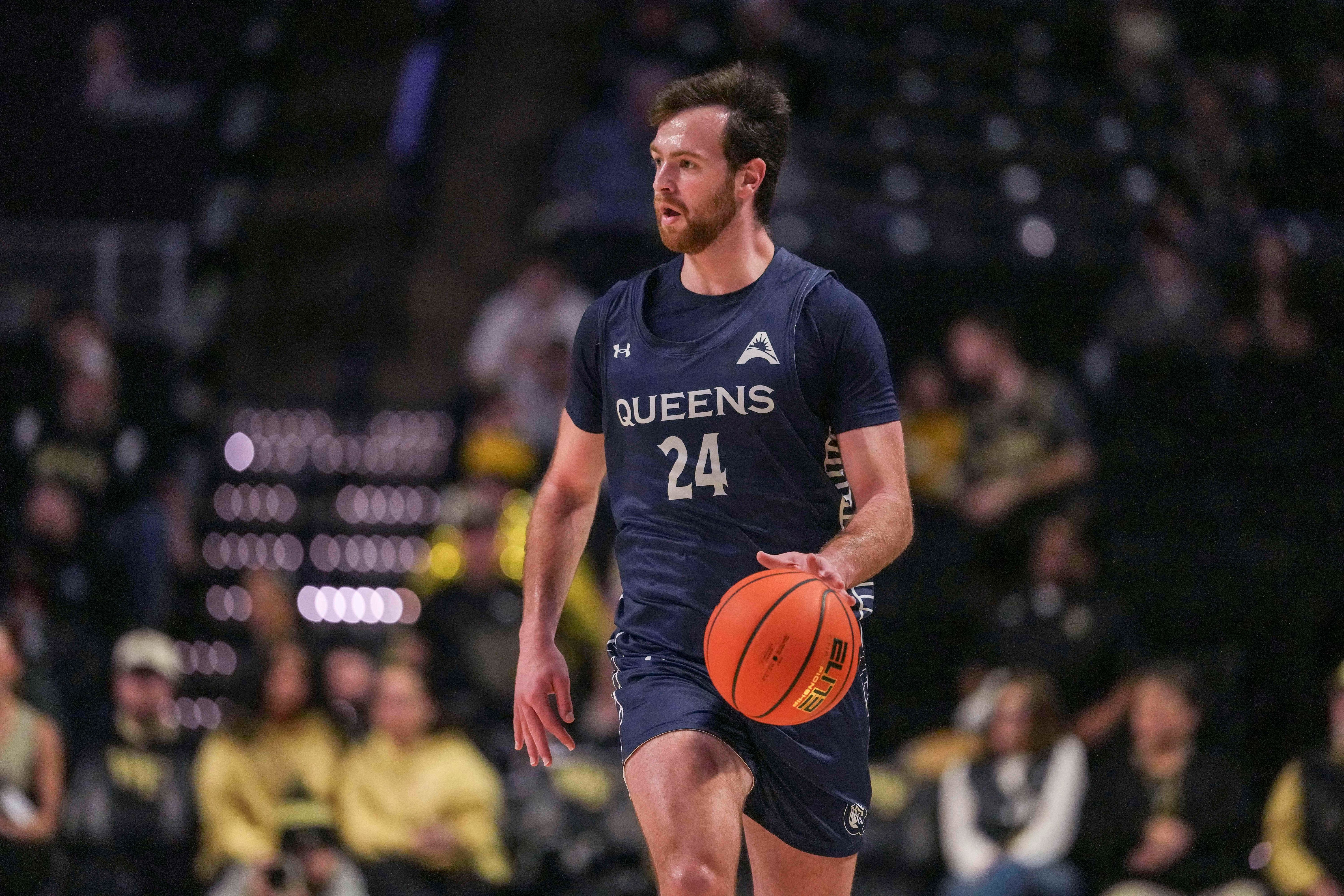 Queens University Royals guard Yoav Berman dribbles as we make our best Queens vs. Purdue prediction and parlay.