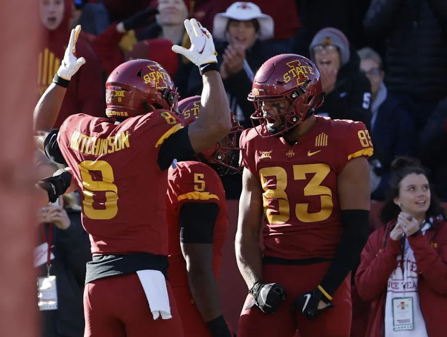 Tight end DeShawn Hanika of the Iowa State Cyclones celebrates with teammate wide receiver Xavier Hutchinson after scoring a touchdown against the West Virginia Mountaineers. 