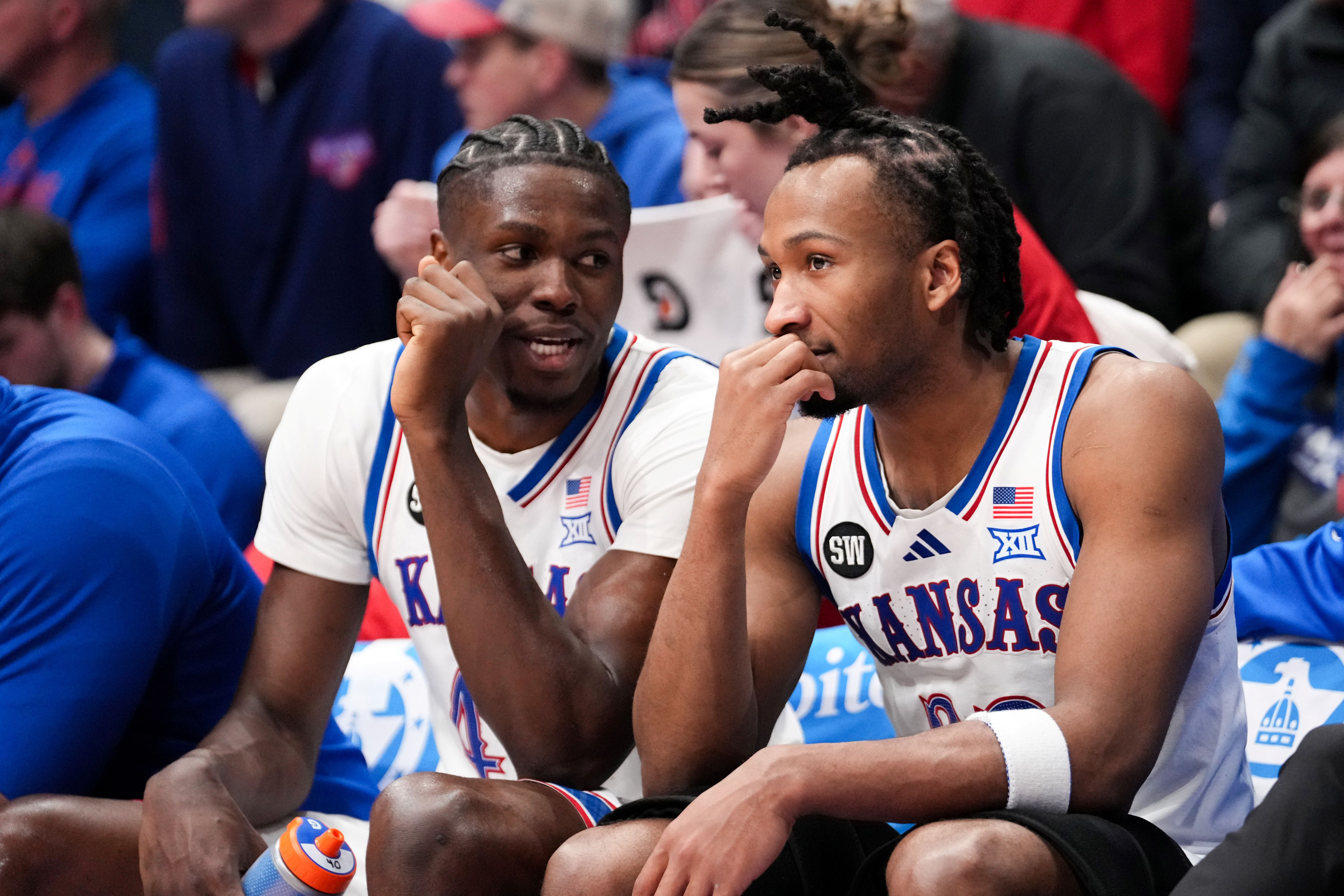 Kansas Jayhawks forward Flory Bidunga (40) - who is featured in our Kansas vs. Colorado prediction - and guard Darryn Peterson (22) talk on the bench.