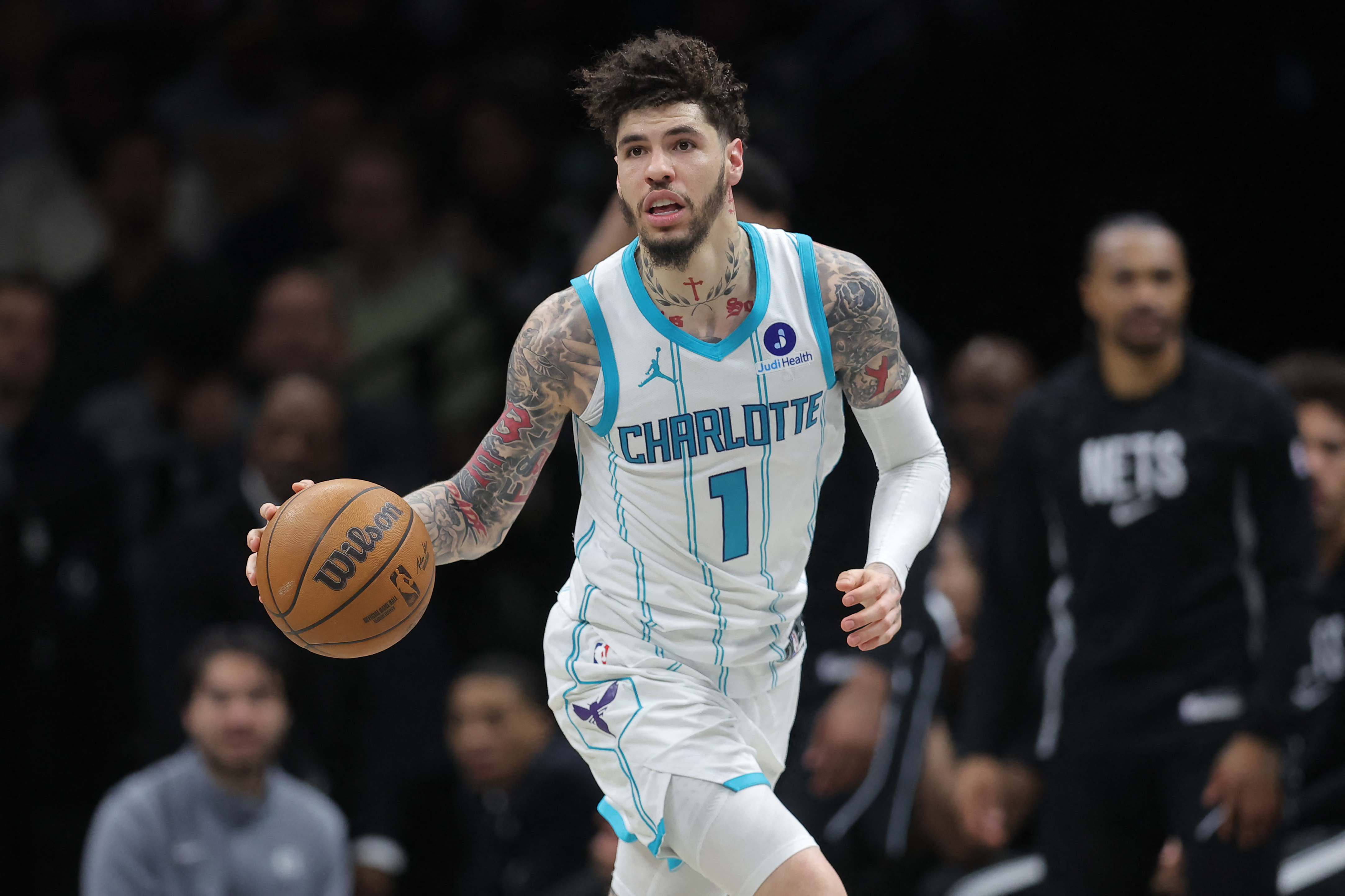 Charlotte Hornets guard LaMelo Ball (1), seen here bringing the ball up the court, is featured in our Heat vs. Hornets player props.