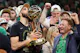 Boston Celtics forward Jayson Tatum (0) kisses the trophy after winning the 2024 NBA Finals, as we look ahead to the 2025 NBA championship odds with the Celtics priced as the favorites to repeat,