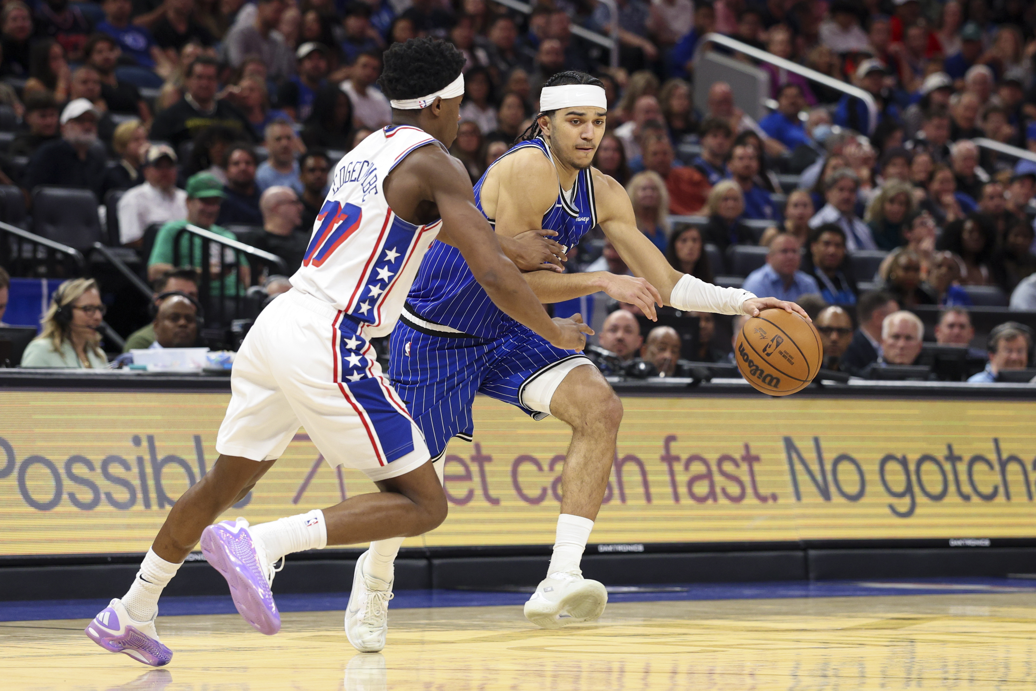 Orlando Magic guard Anthony Black is guarded by Philadelphia 76ers guard VJ Edgecombe as we make our best Magic vs. 76ers prediction.