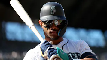 Julio Rodriguez of the Seattle Mariners stands on deck during the fifth inning against the Cincinnati Reds, and we're offering our top MLB player props and expert picks for Friday based on the best MLB odds.