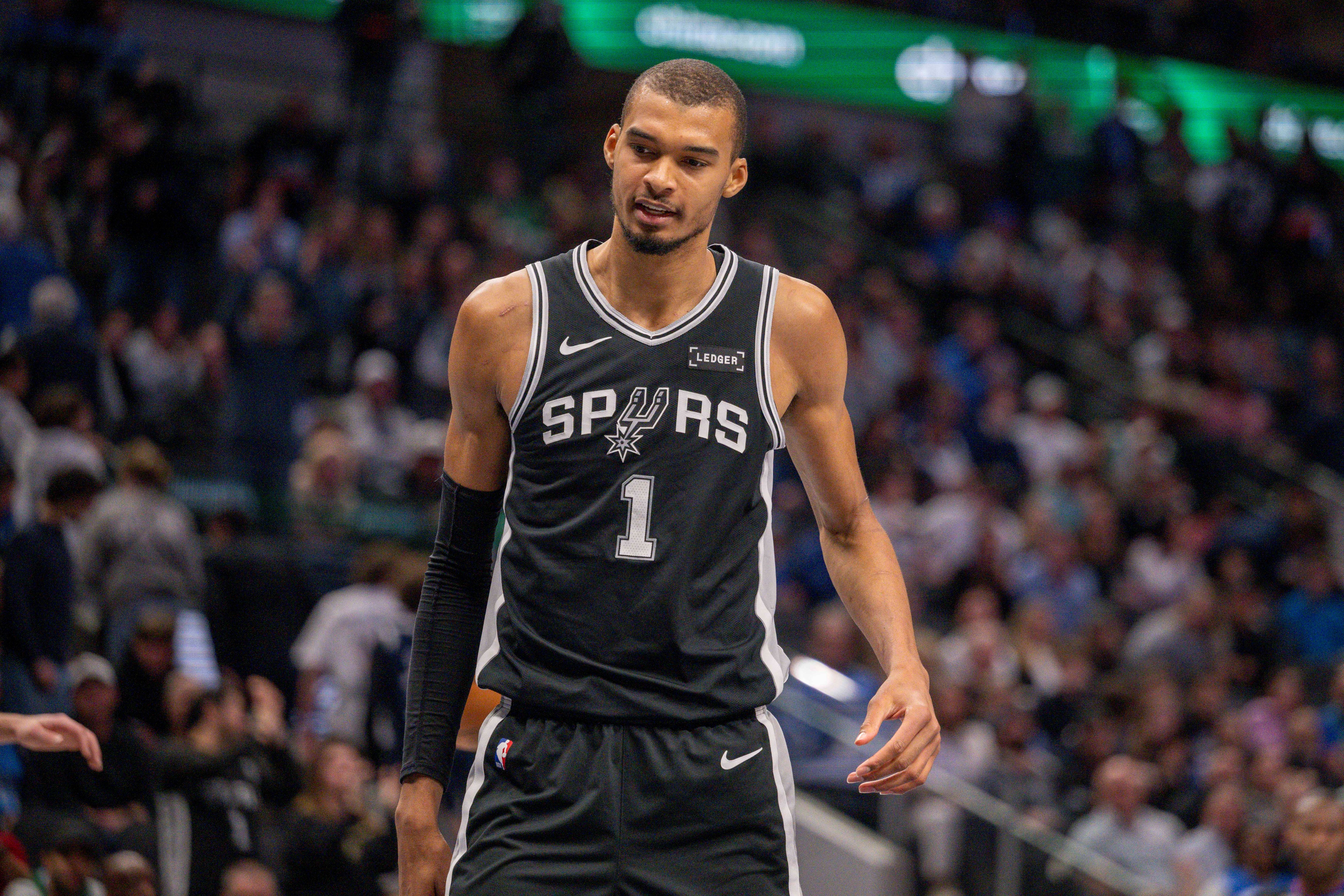 San Antonio Spurs forward Victor Wembanyama (1) looks on as we break down our NBA player props today.